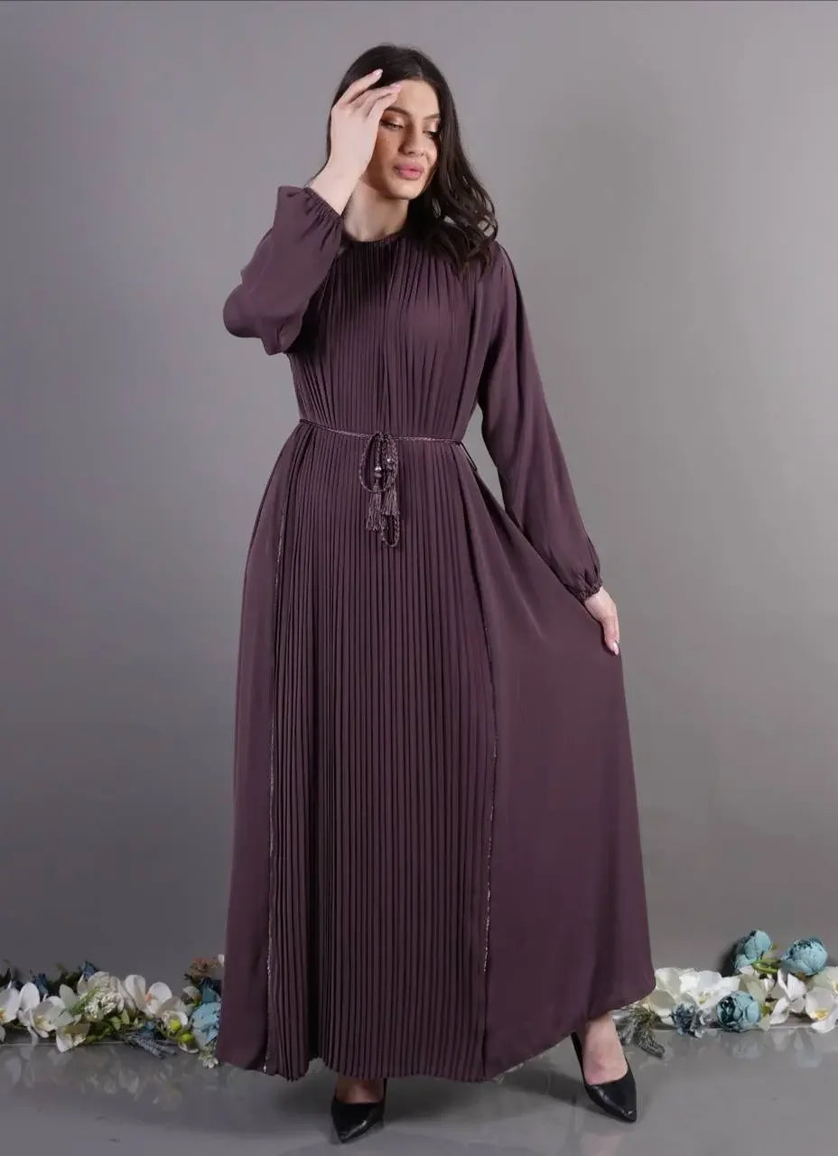 Palestinian Elegance pleated abaya dress in deep plum with long sleeves and waist tie belt