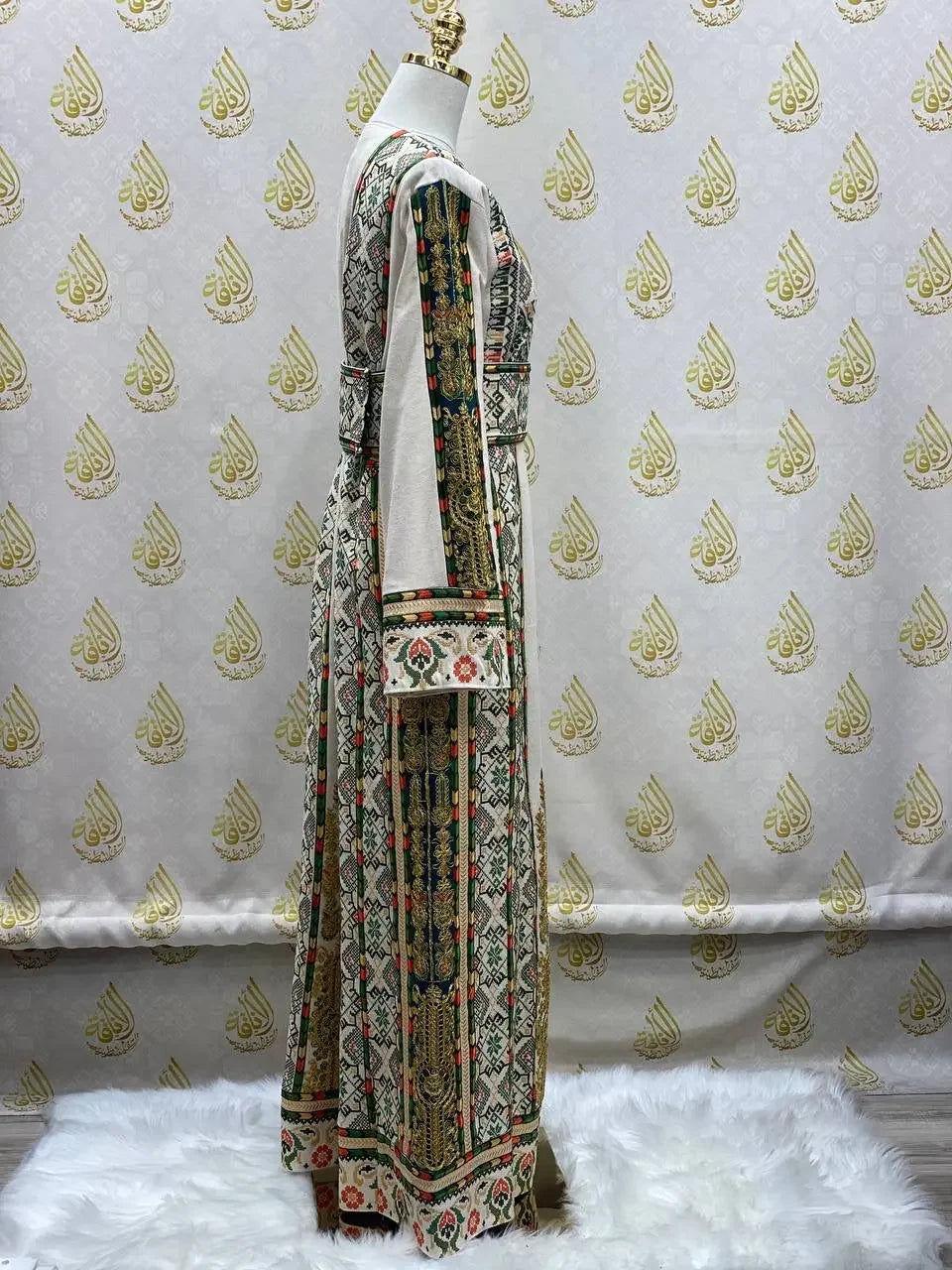 Side view of embroidered Palestinian thobe with intricate multicolor traditional embroidery from Palestinian Elegance