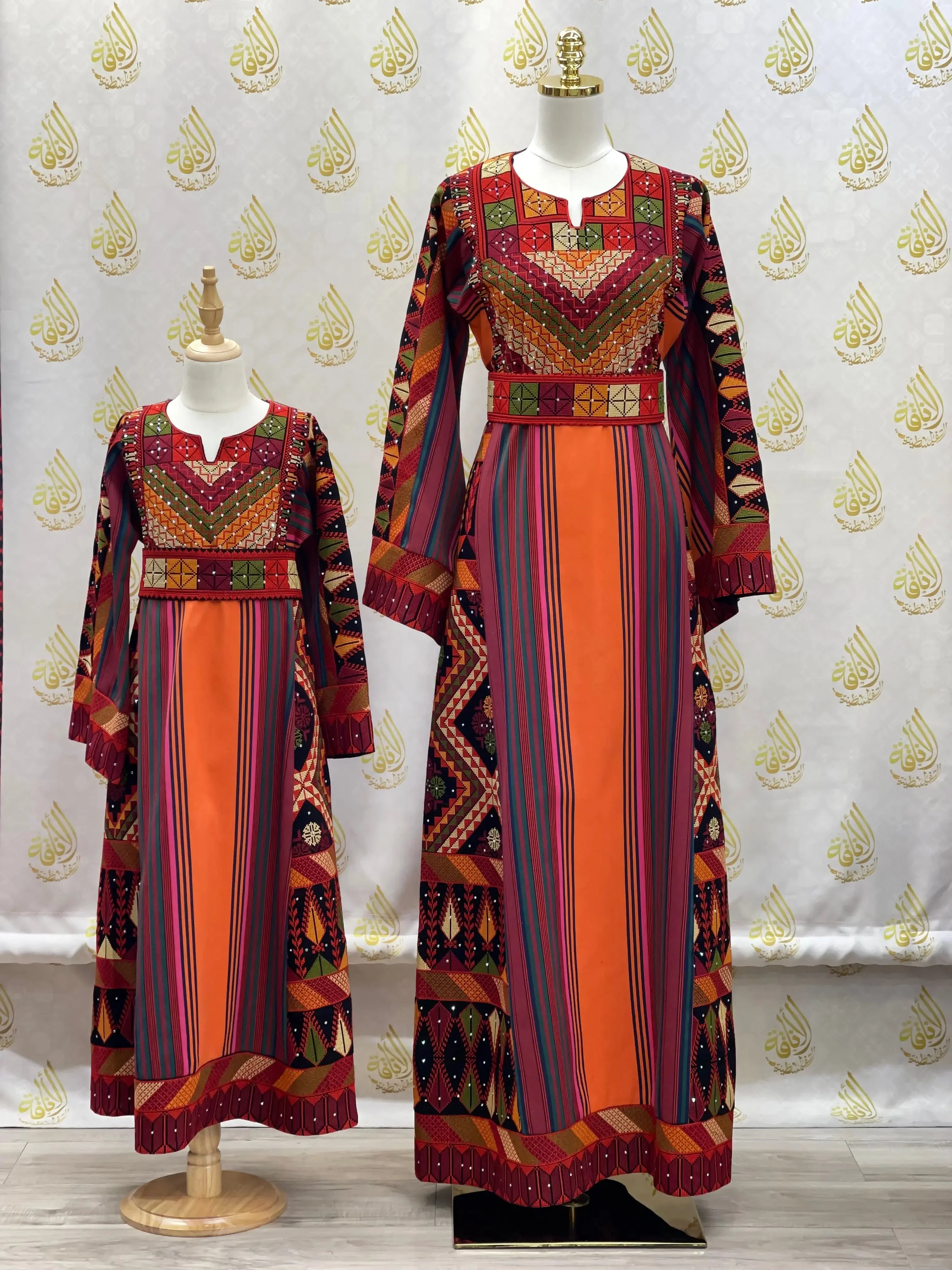Luxury Palestinian thoub dress with vibrant embroidery and striped patterns in adult and child sizes