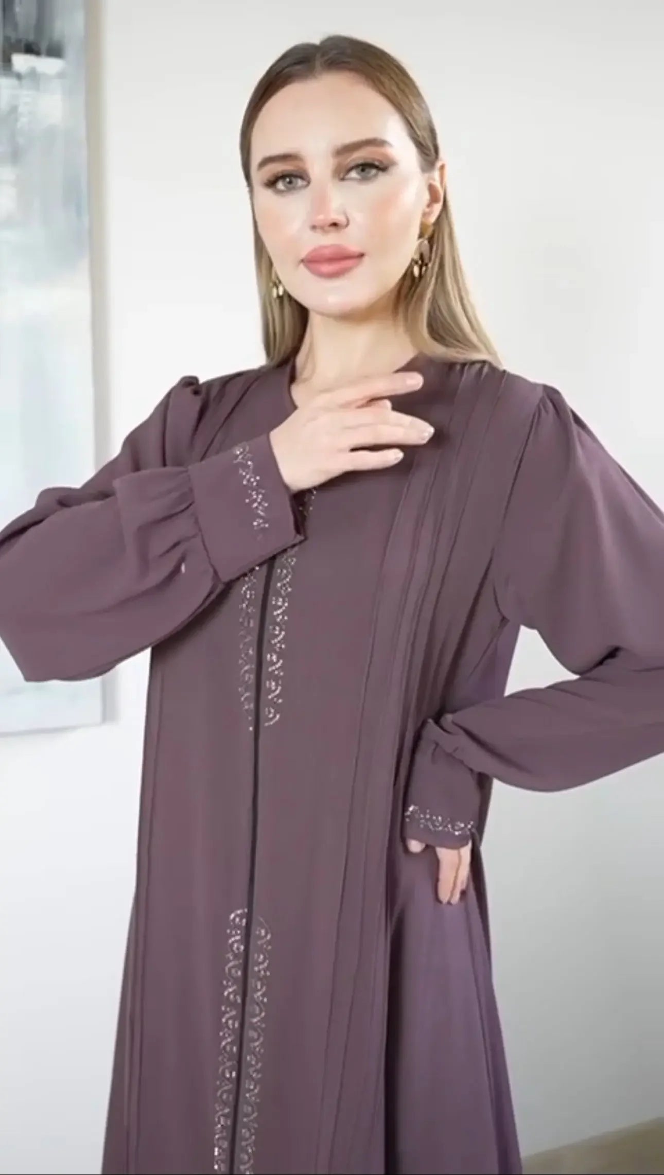 Palestinian Elegance modest abaya for women in deep purple with detailed embroidery on sleeves and front