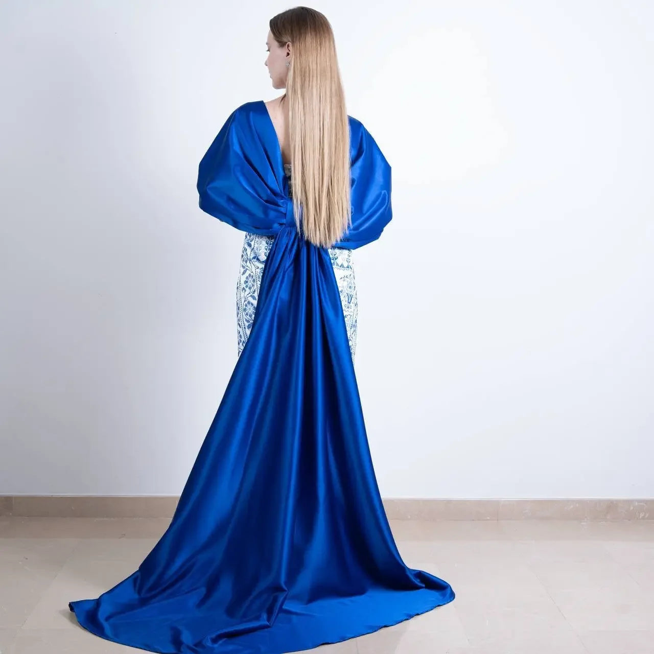 Embroidered Strapless Dress with Oversized Bow: Elegance and Sophistication Palestinian Elegance