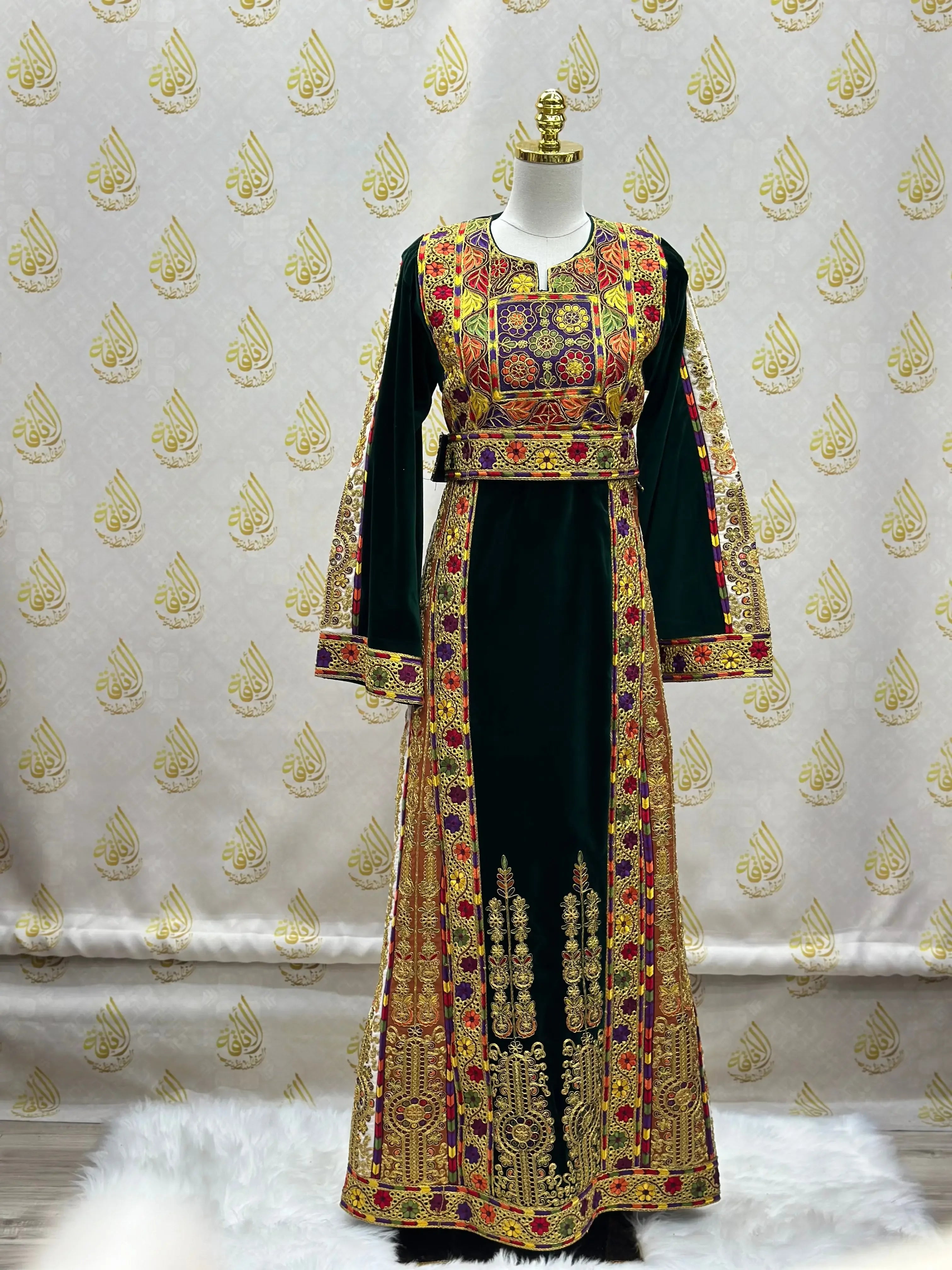 Velvet Palestinian dress with intricate embroidery by Palestinian Elegance on mannequin