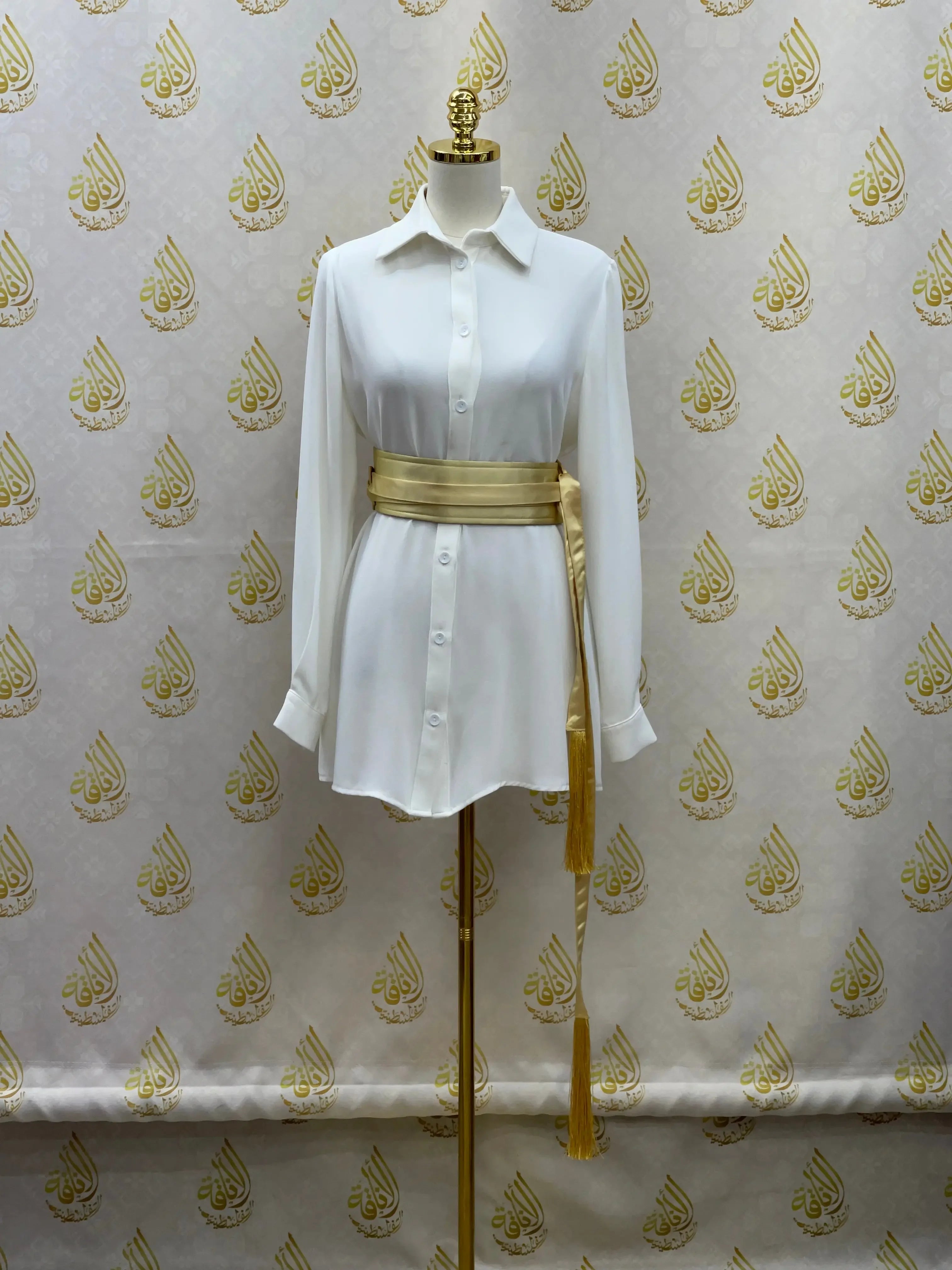 Palestinian Elegance luxury satin belt for dresses wrapped around white button-up shirt on mannequin
