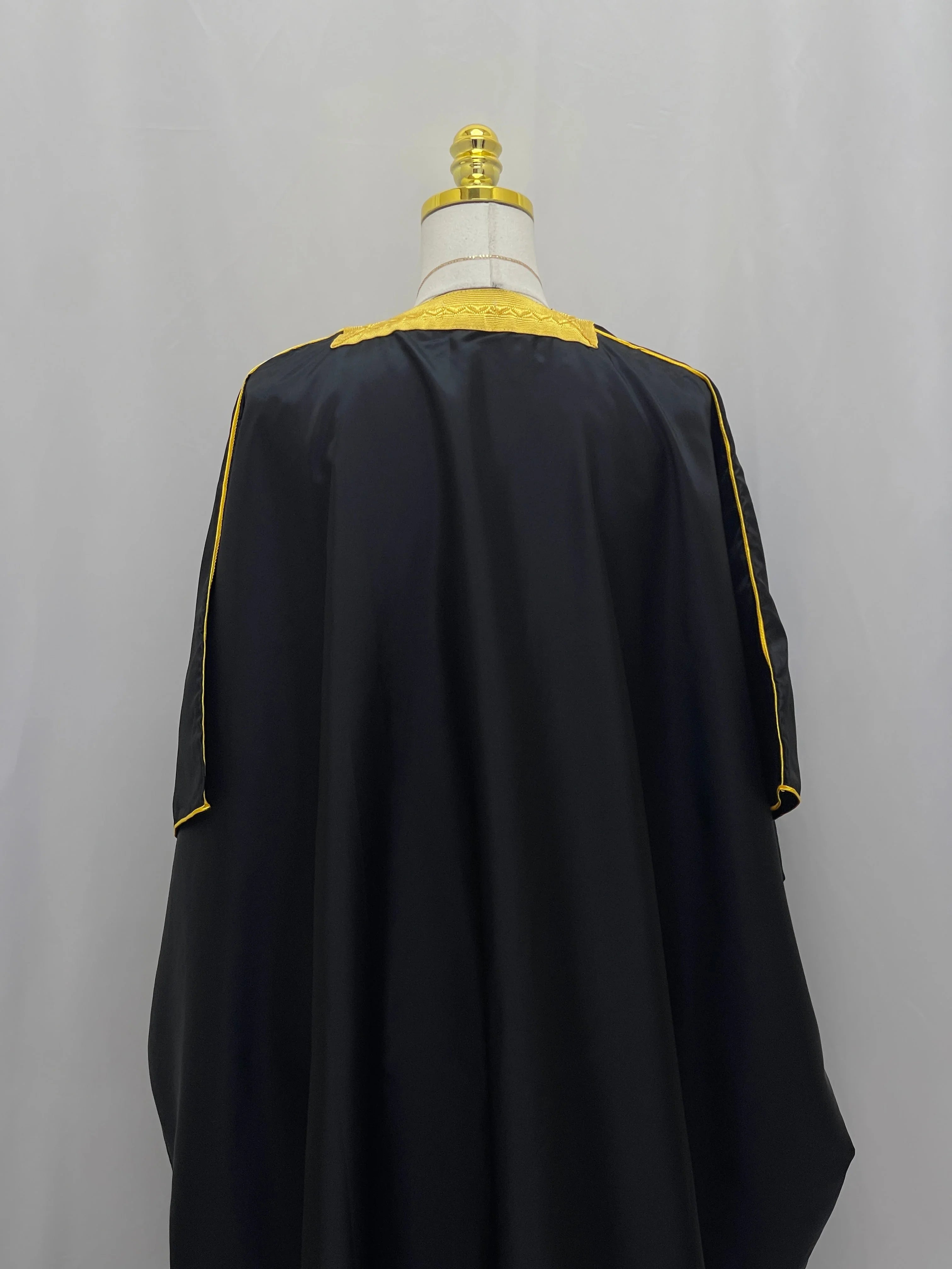 Mens Black Bisht with Golden Trim displayed on a mannequin from the back view