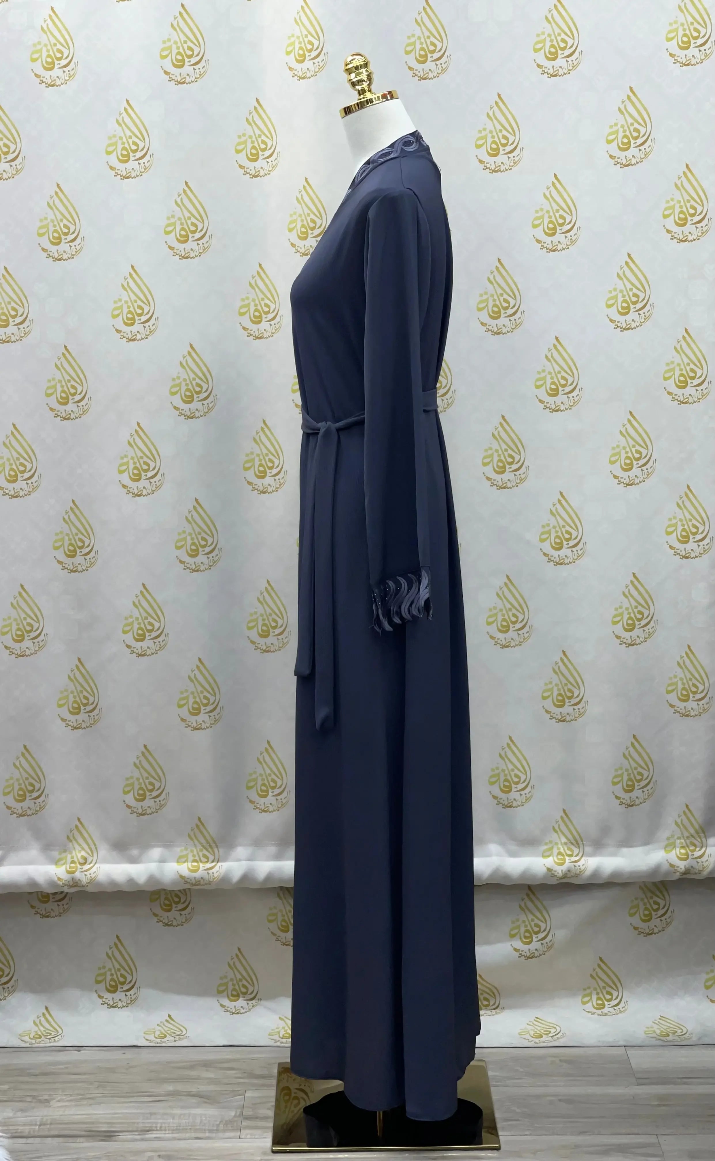 Palestinian Elegance elegant embroidered abaya in navy blue with long sleeves and waist belt