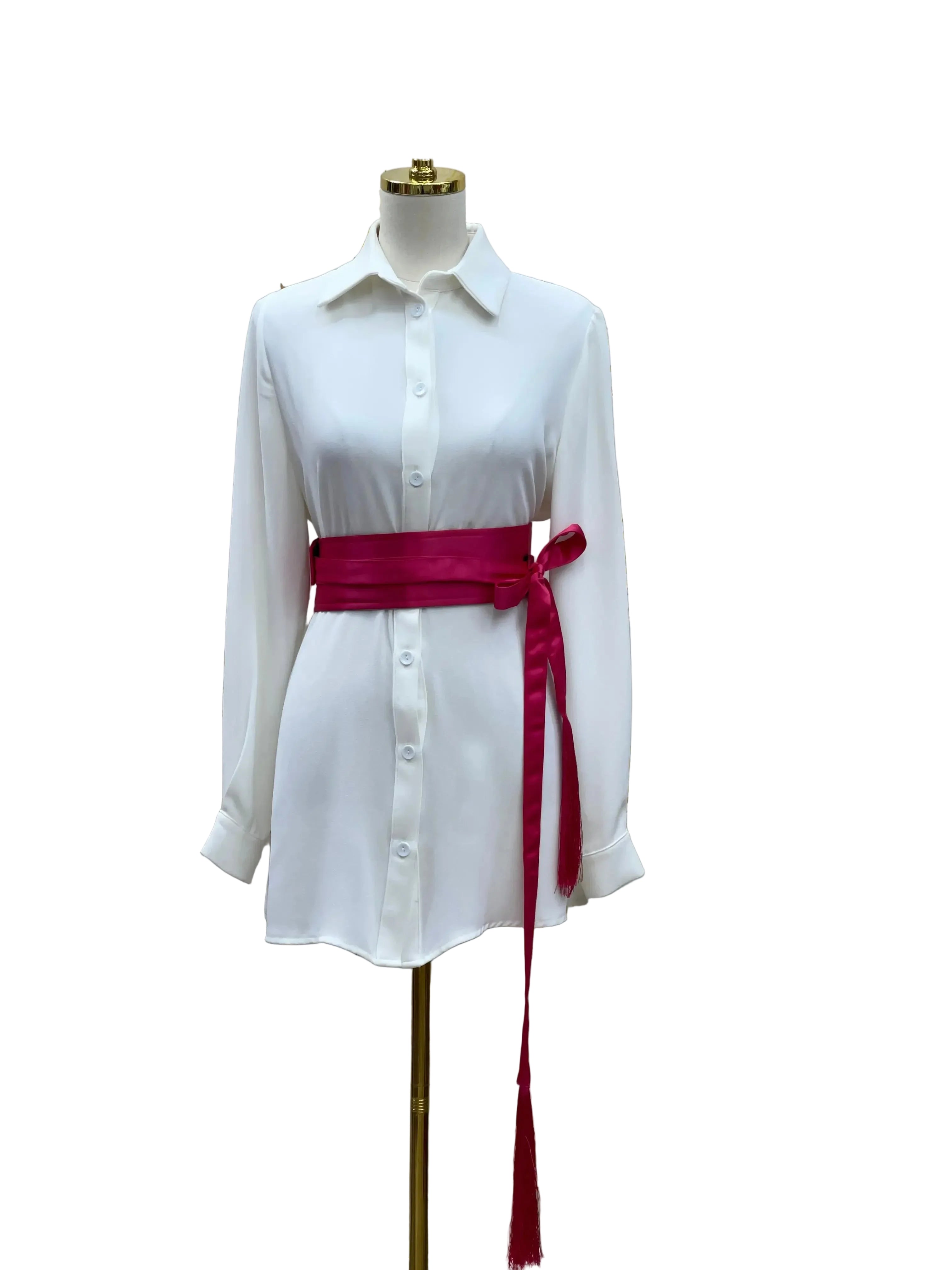 Luxury satin belt for dresses in vibrant pink styled on white button-down dress from Palestinian Elegance