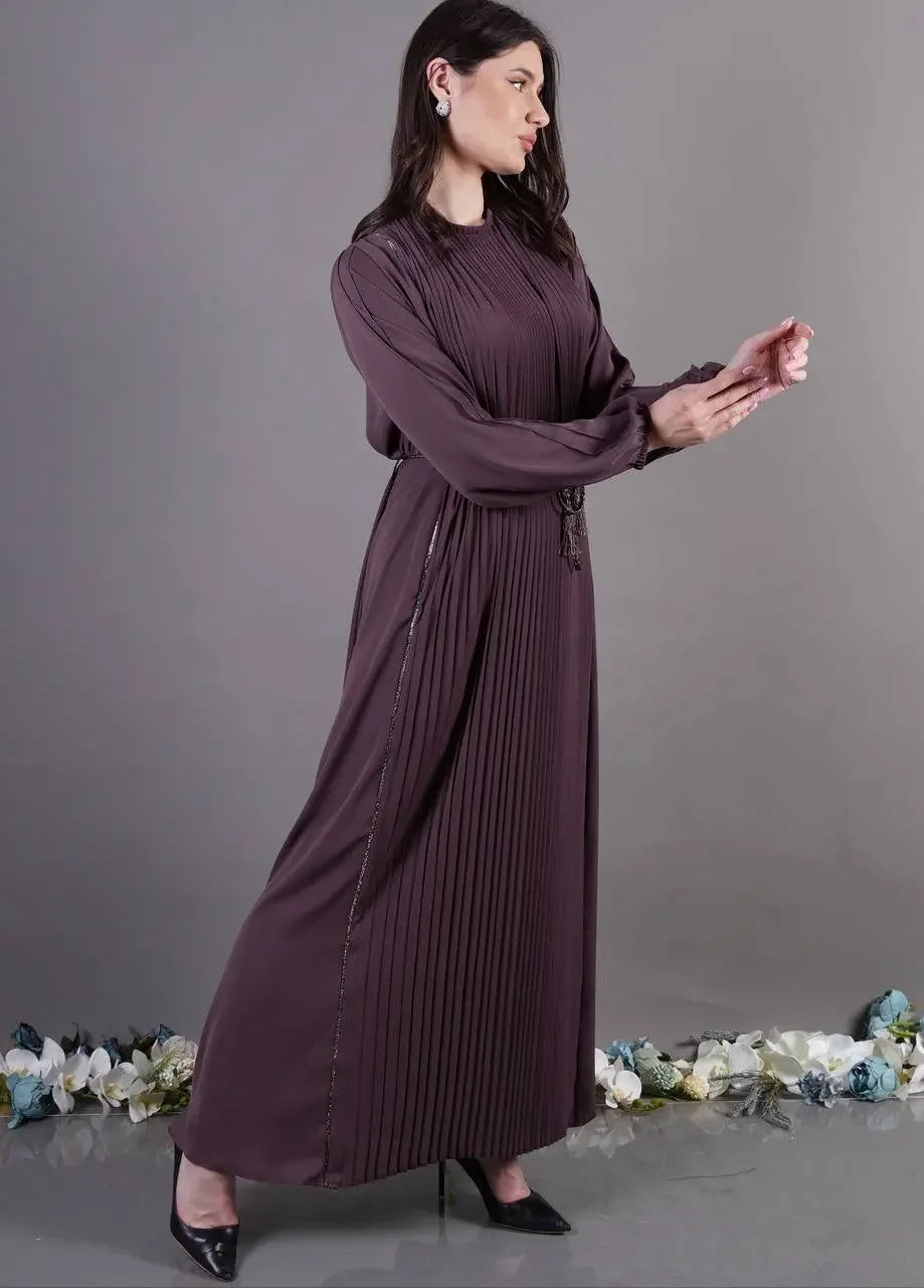 Palestinian Elegance pleated abaya dress in deep purple with long sleeves and a high neckline