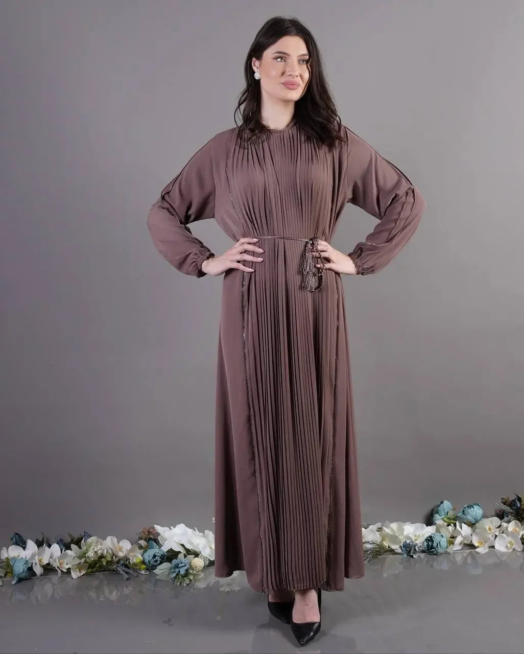 Palestinian Elegance pleated abaya dress in brown with long sleeves and tassel belt detail