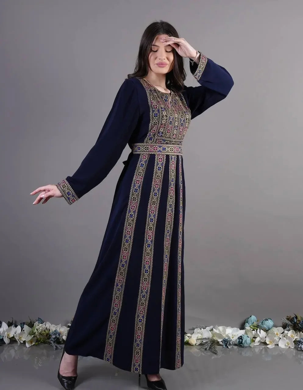 Palestinian Elegance embroidered abaya dress in navy blue with traditional multicolor embroidery on front and sleeves