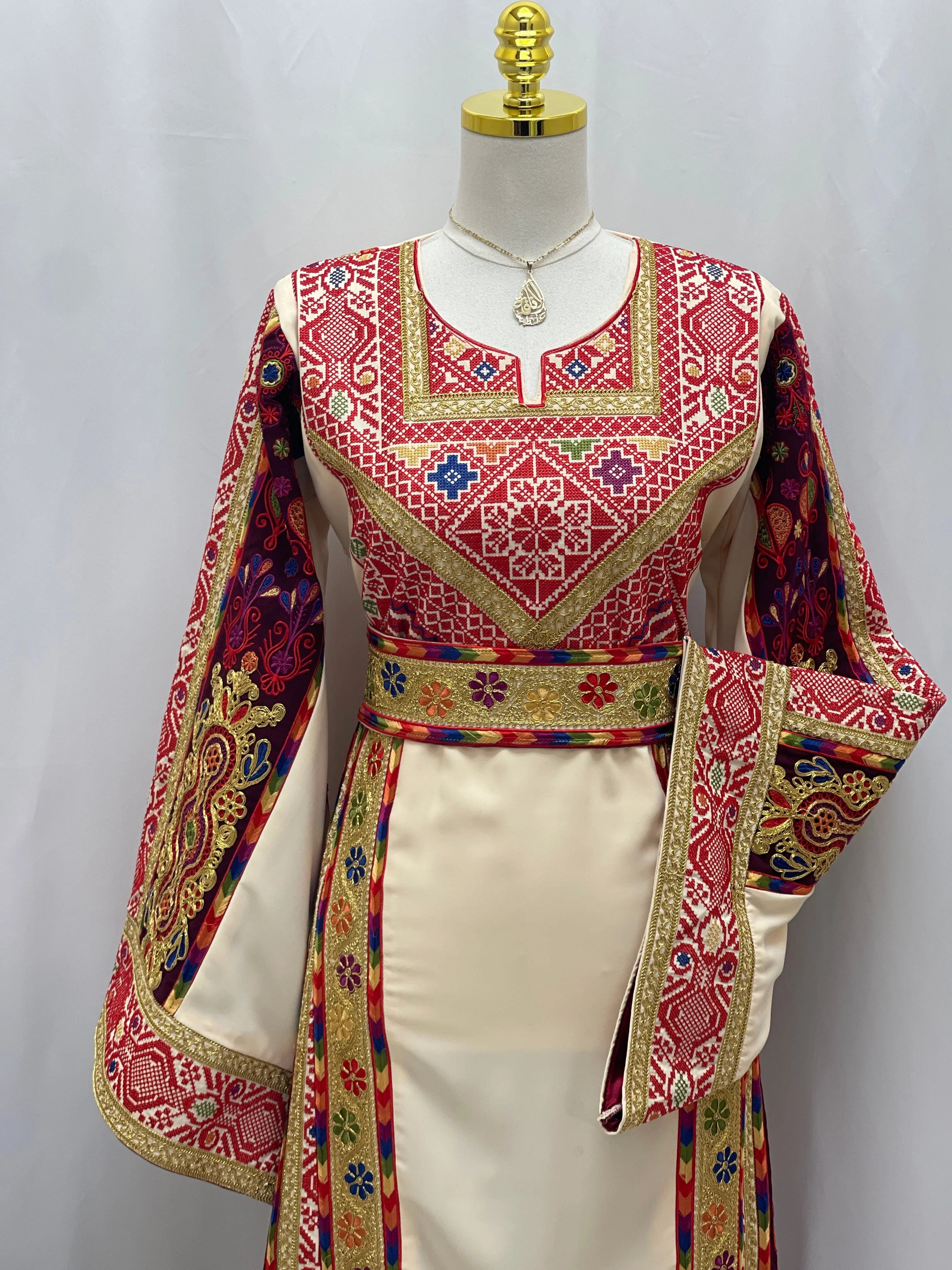 Al Kananiyyah Embroidered Thobe featuring intricate colorful patterns and elegant details for special occasions