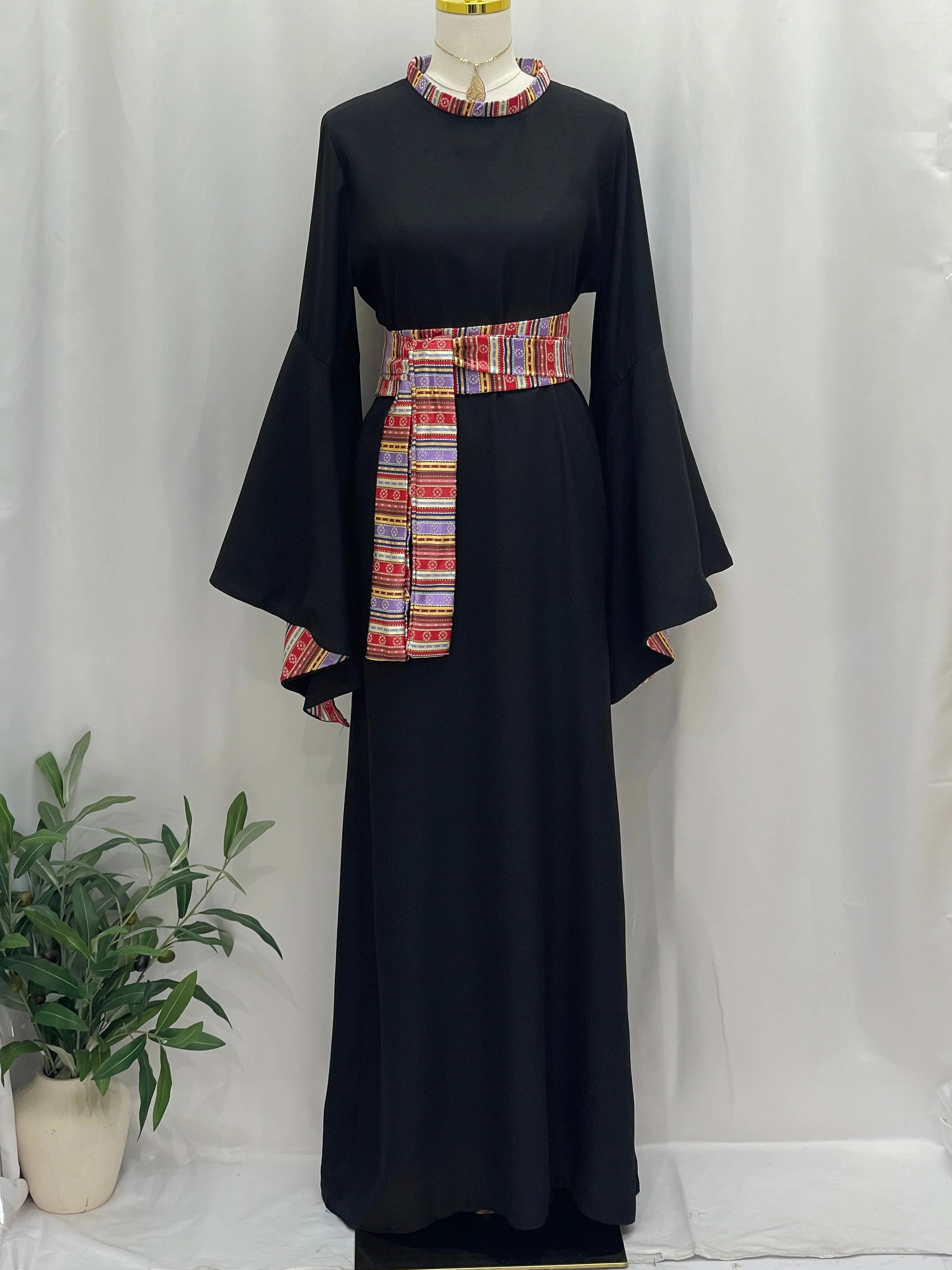 Elegant Al-Mais Thobe in black with colorful embroidered belt and bell sleeves for stylish occasions