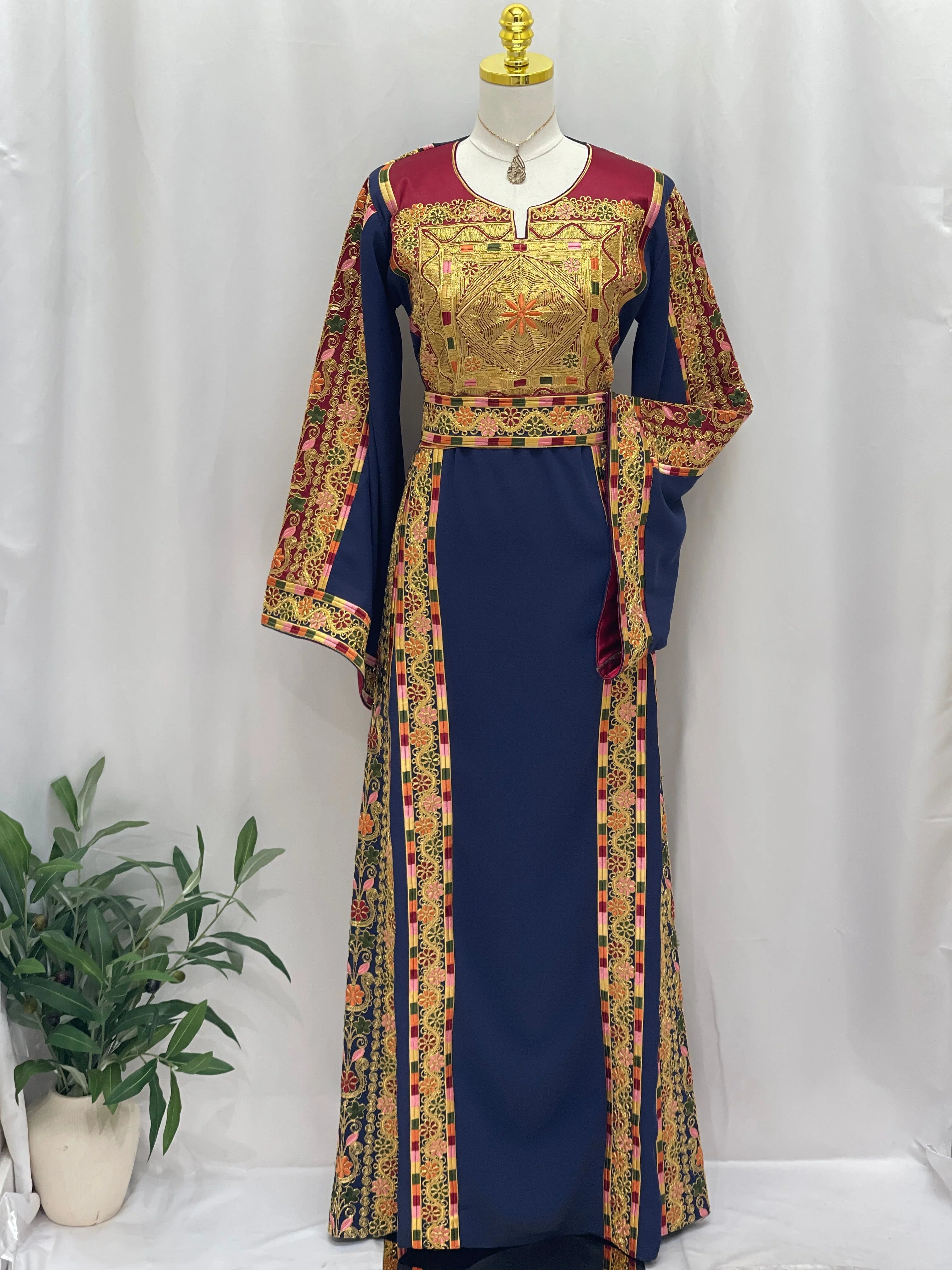 Elegant Al-Qasab Malaki Thobe featuring intricate embroidery and vibrant colors for traditional wear