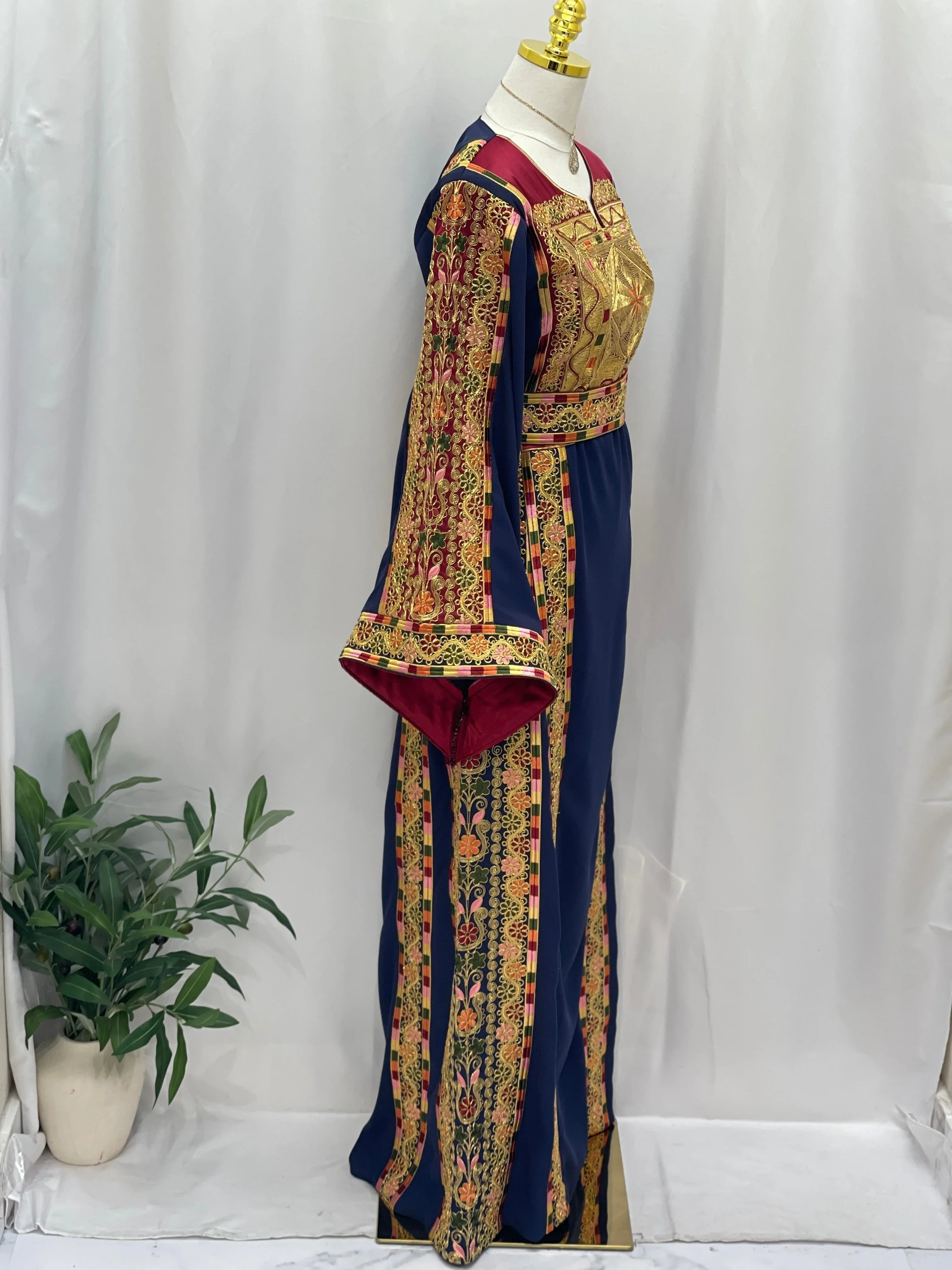 Al-Qasab Malaki Thobe with intricate embroidery and vibrant colors, perfect for special occasions