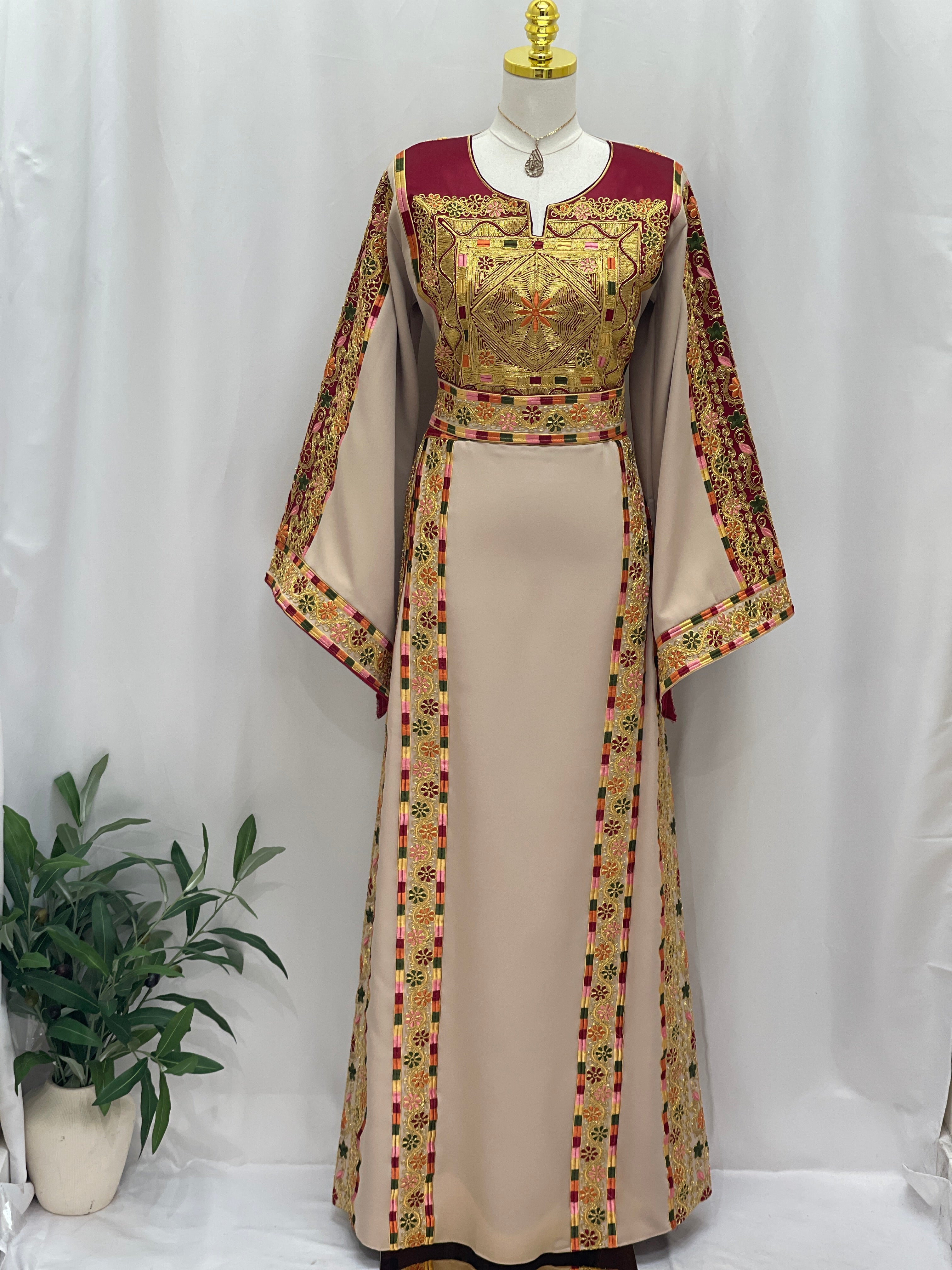 Elegant Al-Qasab Malaki Thobe with Intricate Embroidery and Flowing Sleeves in Soft Beige Color