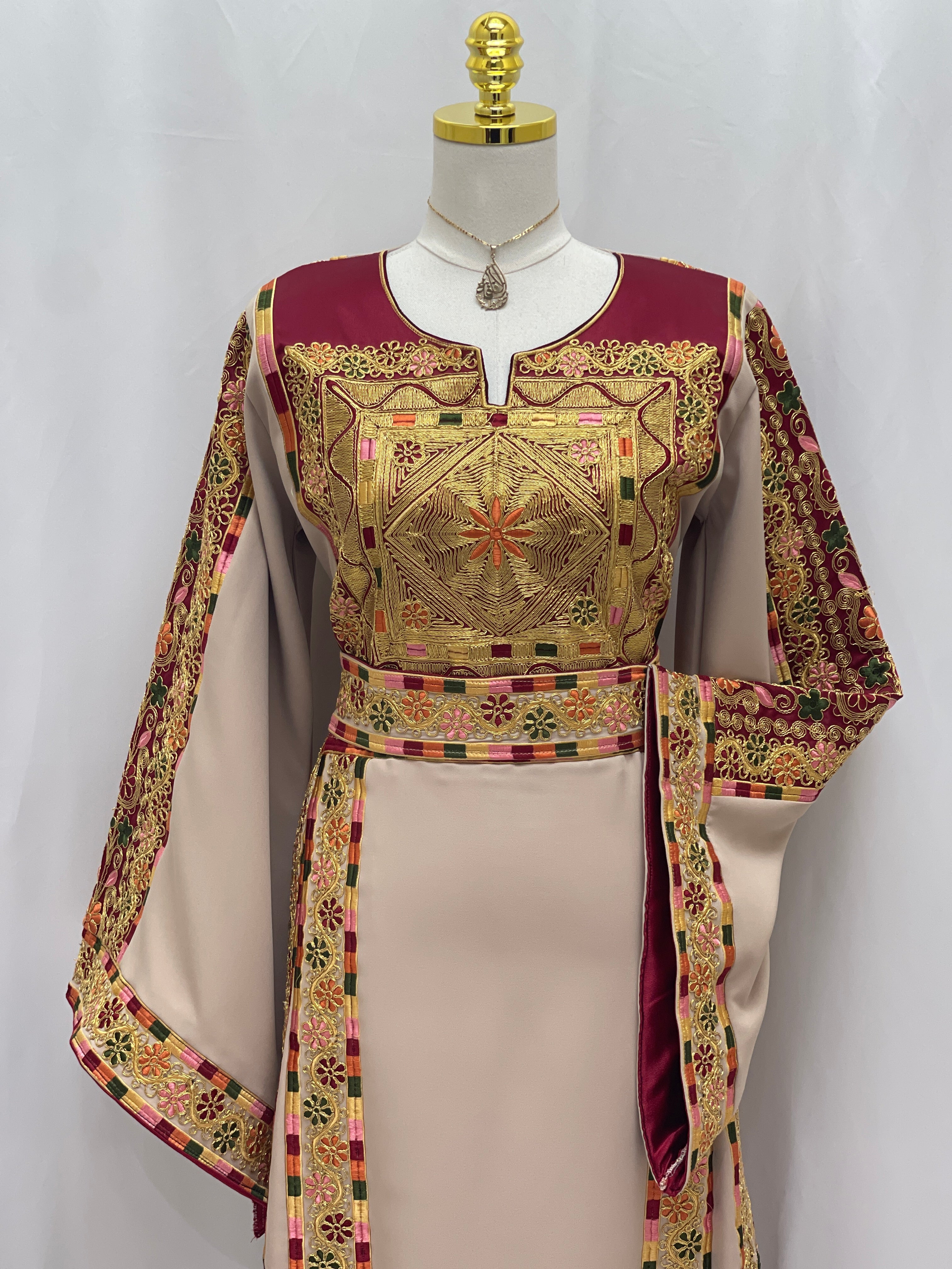 Al-Qasab Malaki Thobe featuring intricate embroidery and elegant design for traditional style