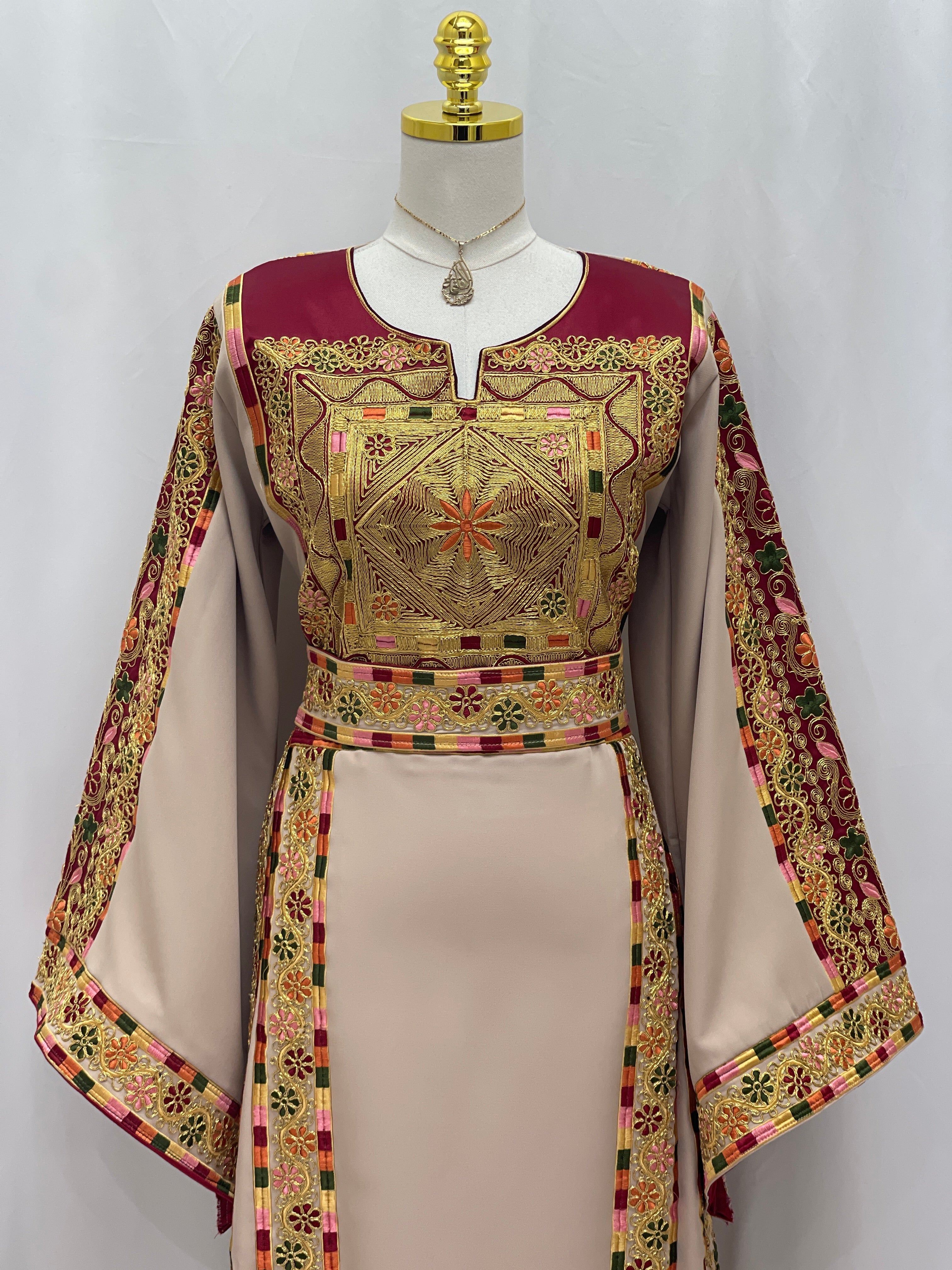 Al-Qasab Malaki Thobe in elegant beige with intricate embroidery and traditional designs for special occasions