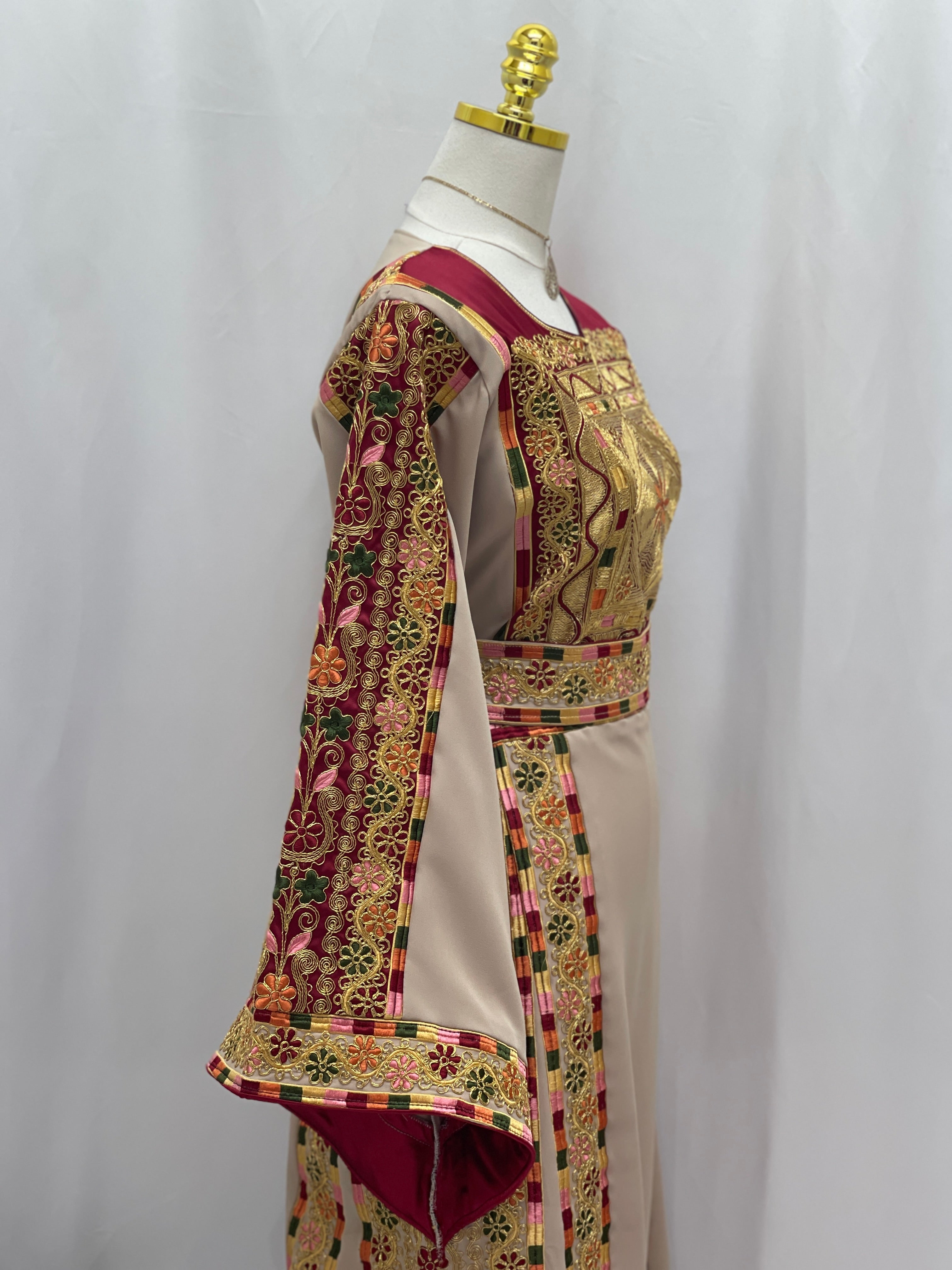 Elegant Al-Qasab Malaki Thobe featuring intricate embroidery and wide sleeves for a traditional look