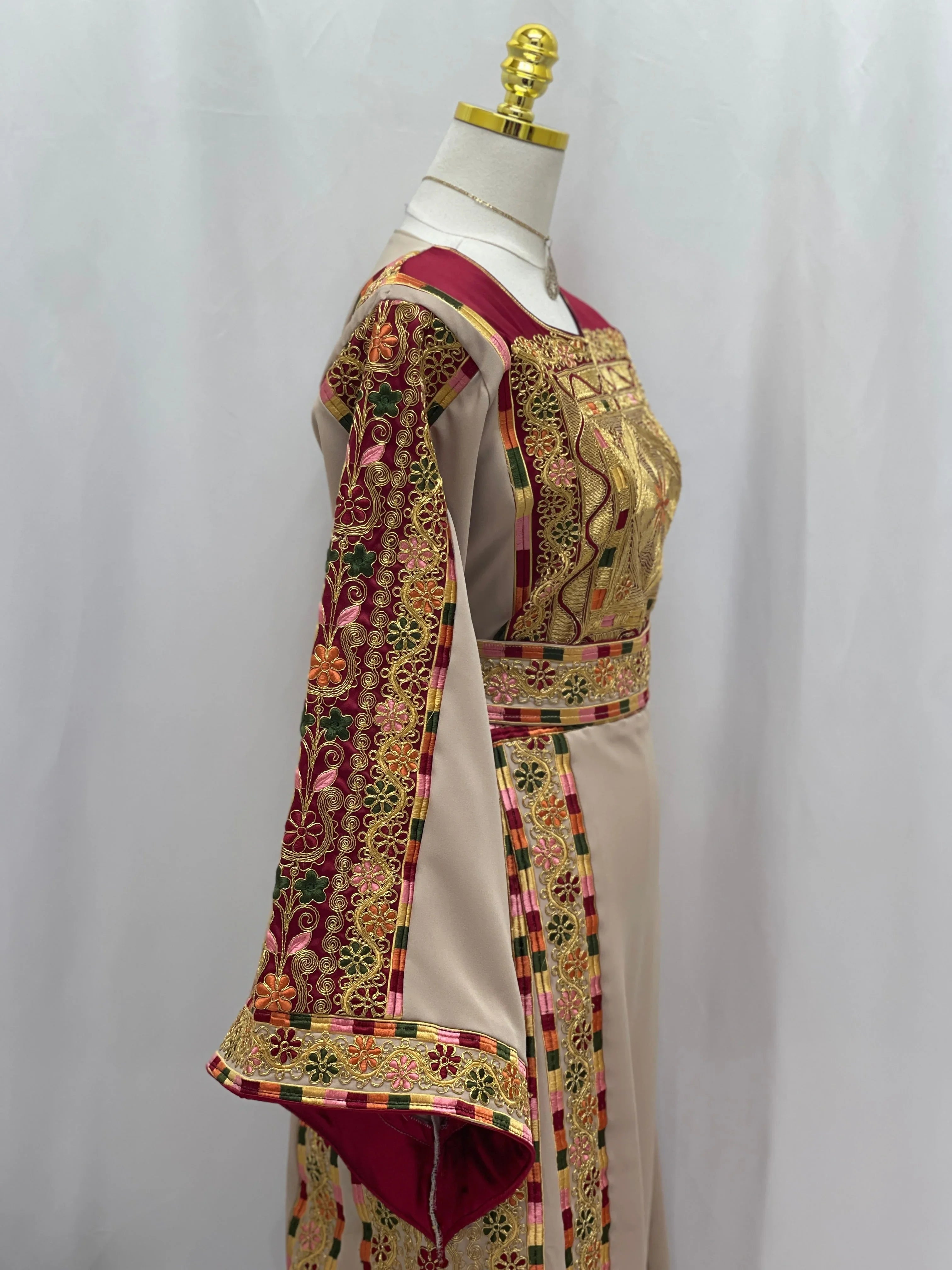 Elegant Al-Qasab Malaki Thobe featuring intricate embroidery and wide sleeves for a traditional look