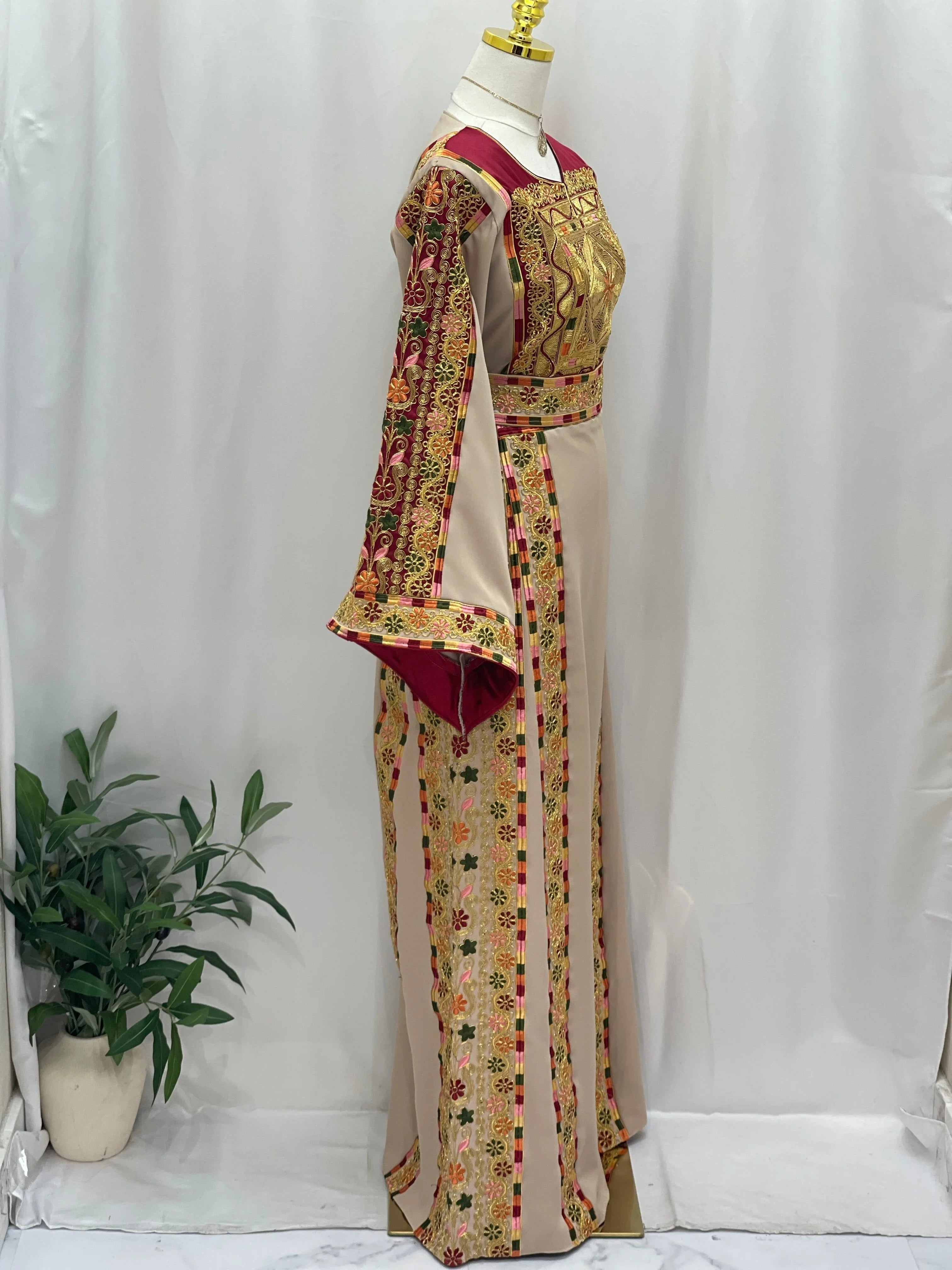 Elegant Al-Qasab Malaki Thobe with intricate embroidery and detailed sleeves, perfect for traditional events.