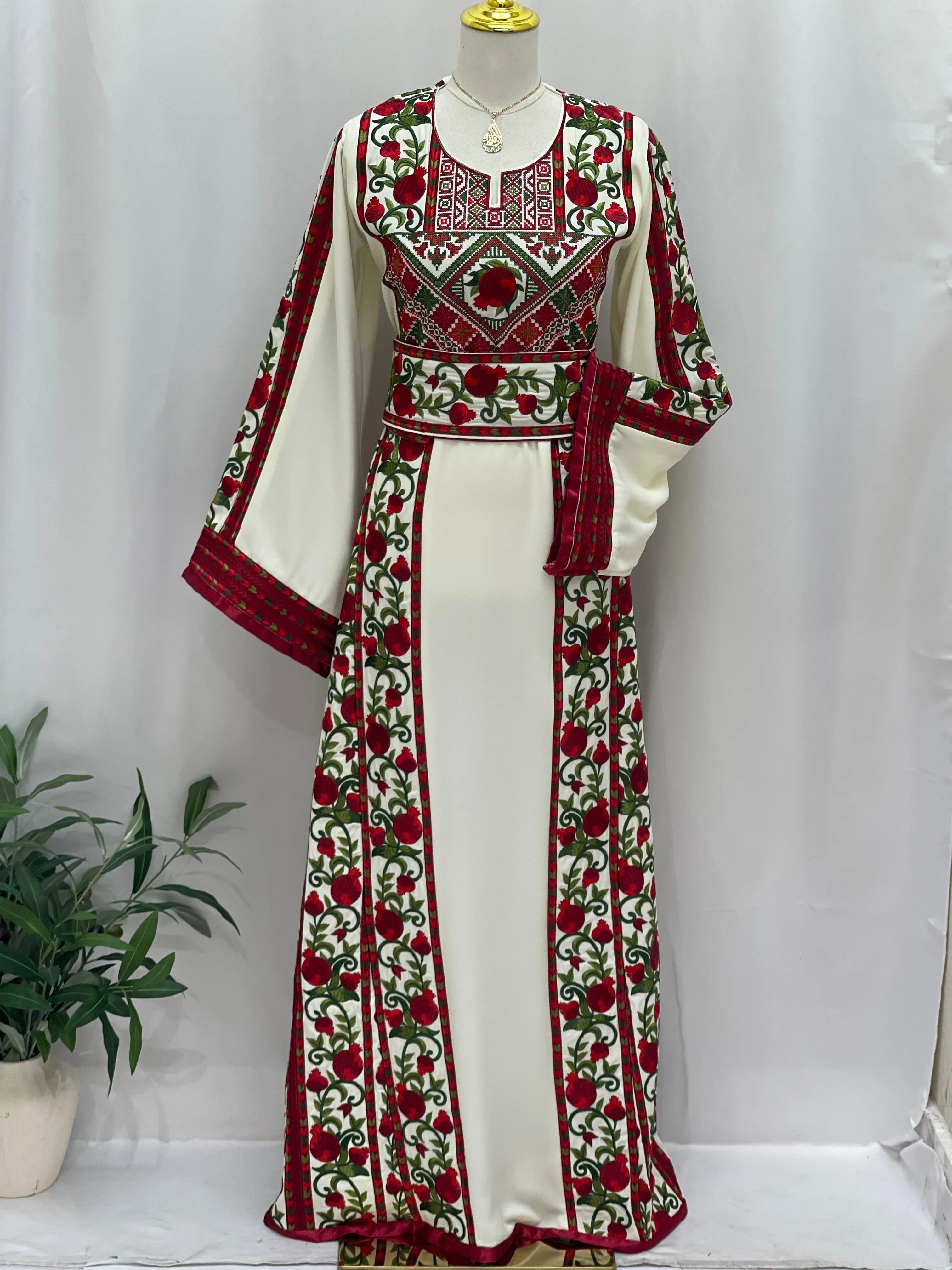 Palestinian Elegance Al Romana Pomegranate Embroidered Thoub white dress with red and green intricate embroidery