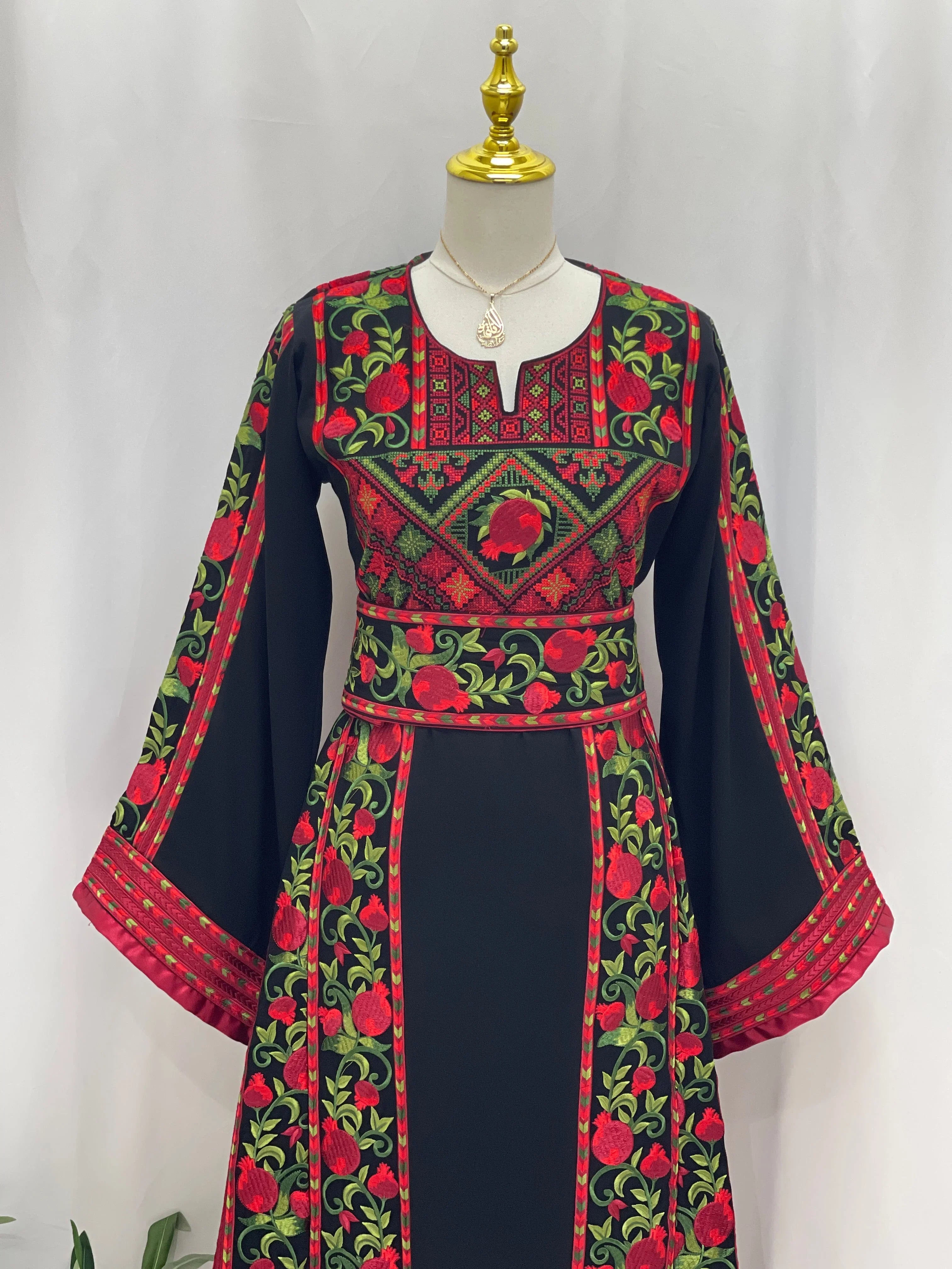 Al Romana Pomegranate Embroidered Thoub by Palestinian Elegance with intricate red and green embroidery