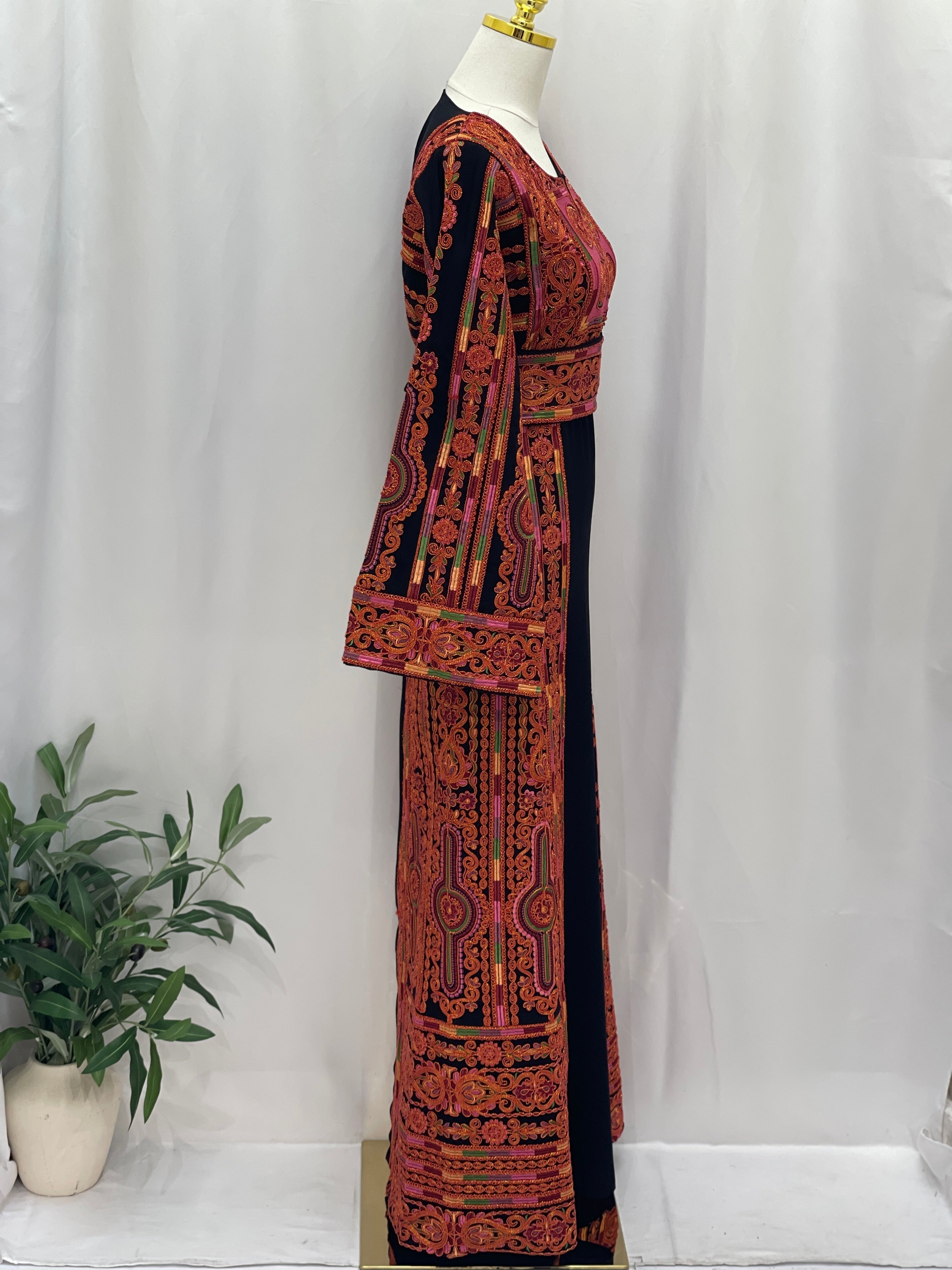 Al-Sundus Bream Embroidered Thobe . Palestinian Elegance black thobe with red orange hand embroidery and long sleeves