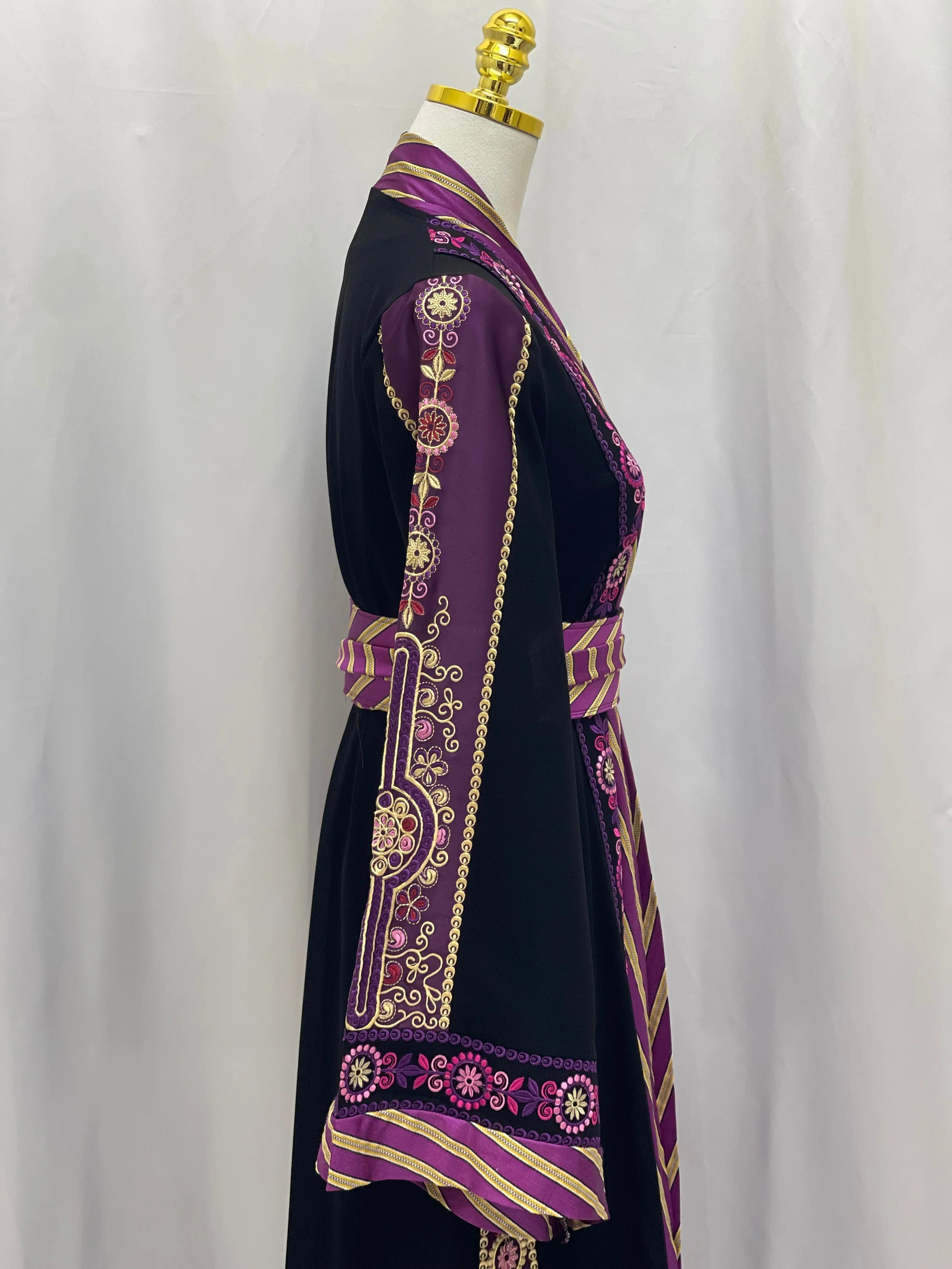 Palestinian Elegance embroidered Kashmir abaya in black with intricate purple and gold floral embroidery on sleeve and belt