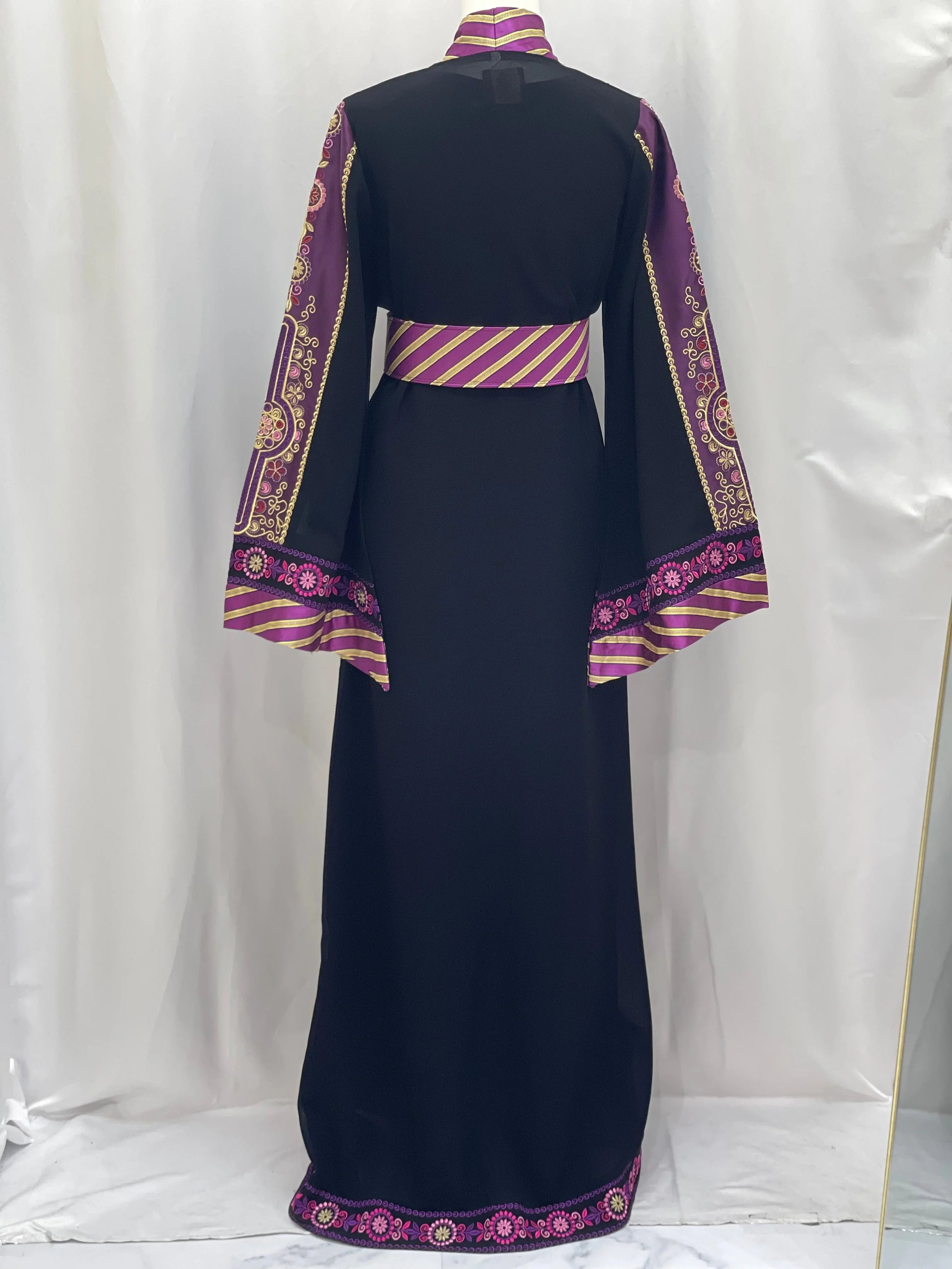 Back view of Palestinian Elegance embroidered Kashmir abaya in black with purple and gold embroidered sleeves and hem