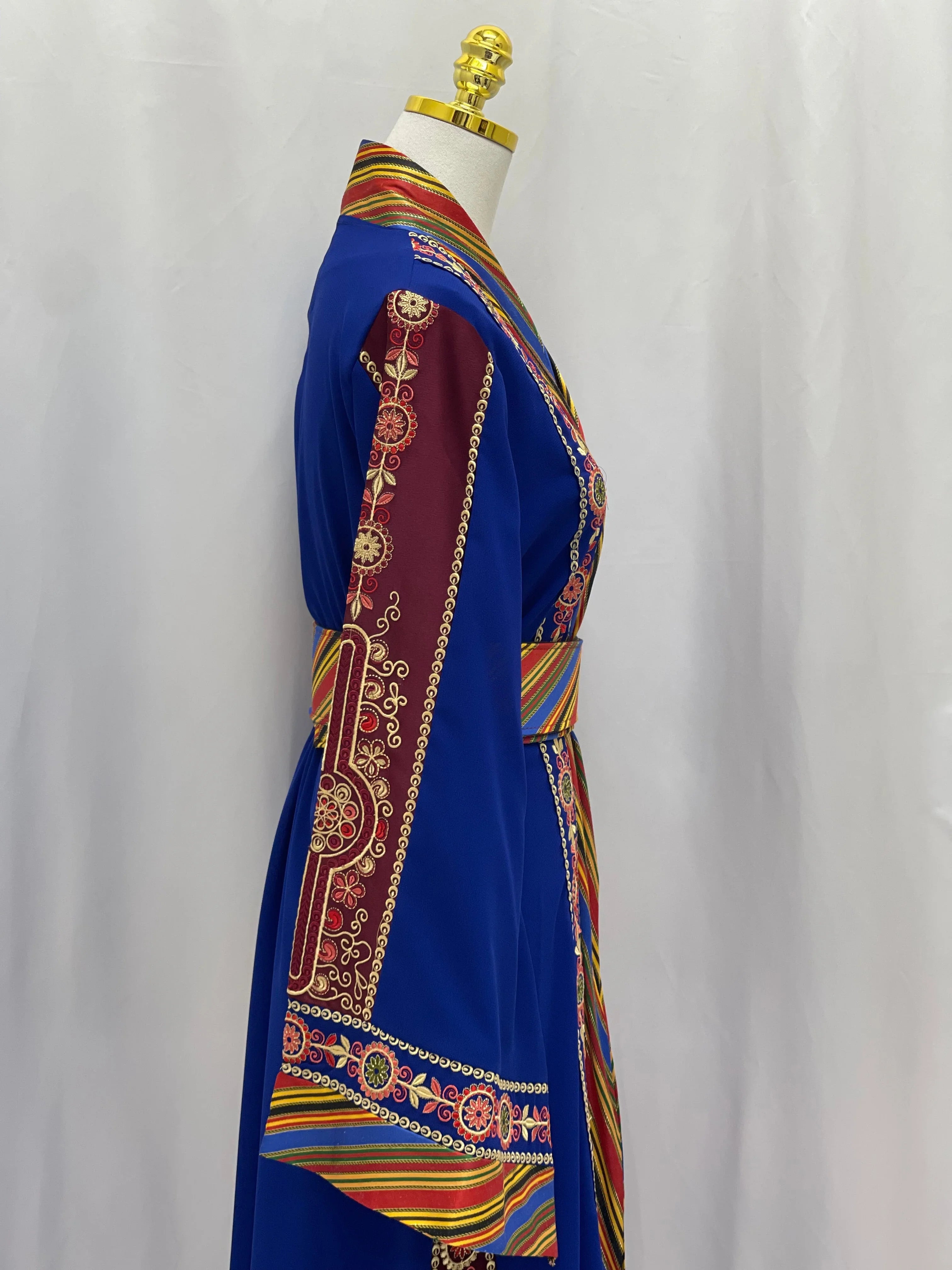 Palestinian Elegance embroidered Kashmir abaya in royal blue with intricate red and gold sleeve embroidery