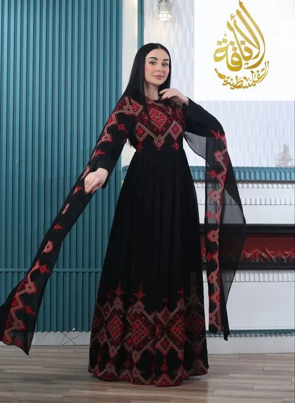 Modern embroidered Palestinian dress in black with red geometric patterns by Palestinian Elegance
