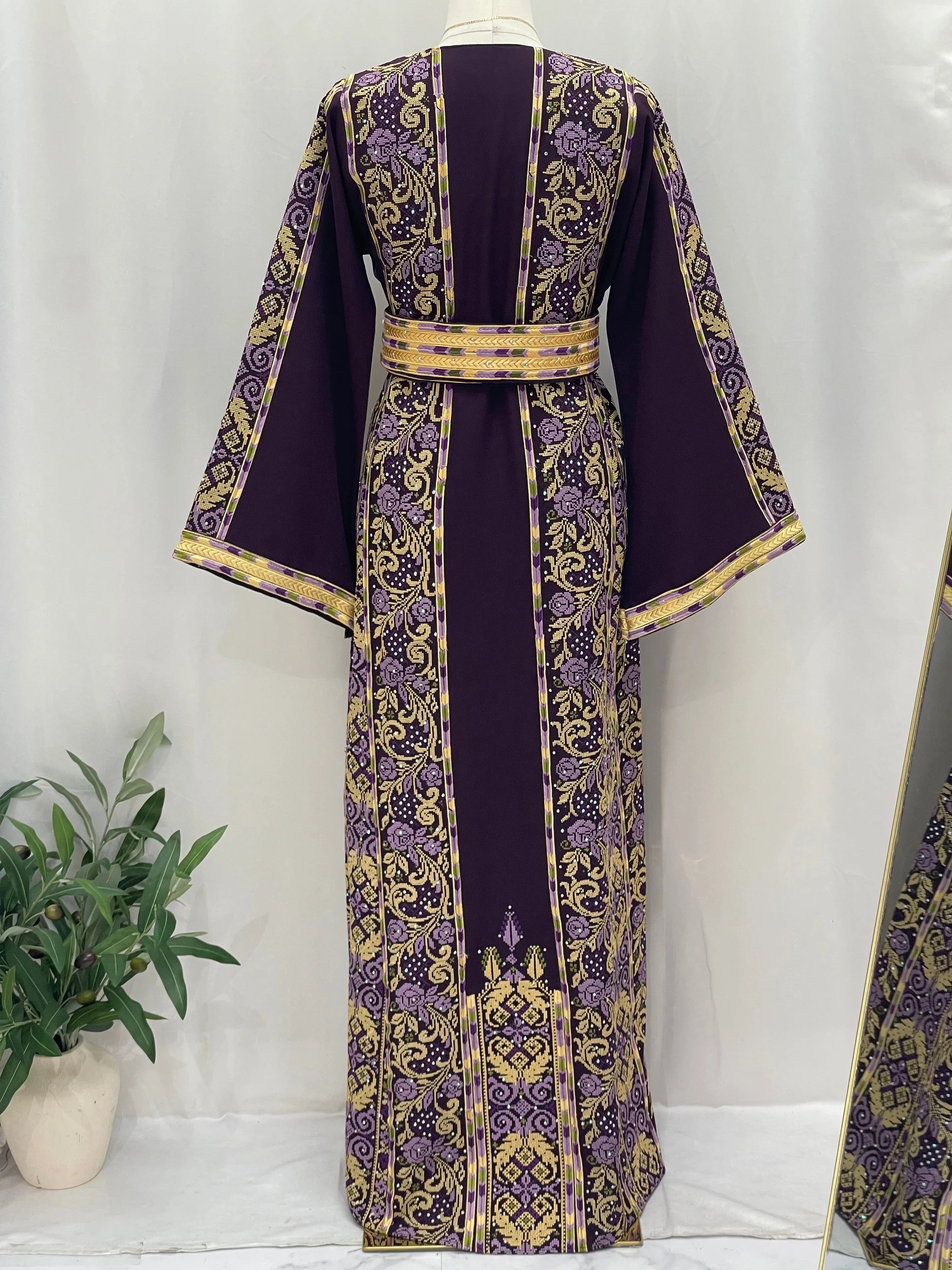Elegant Arjwan Embroidered Thoub in purple with intricate gold patterns and a matching waist belt