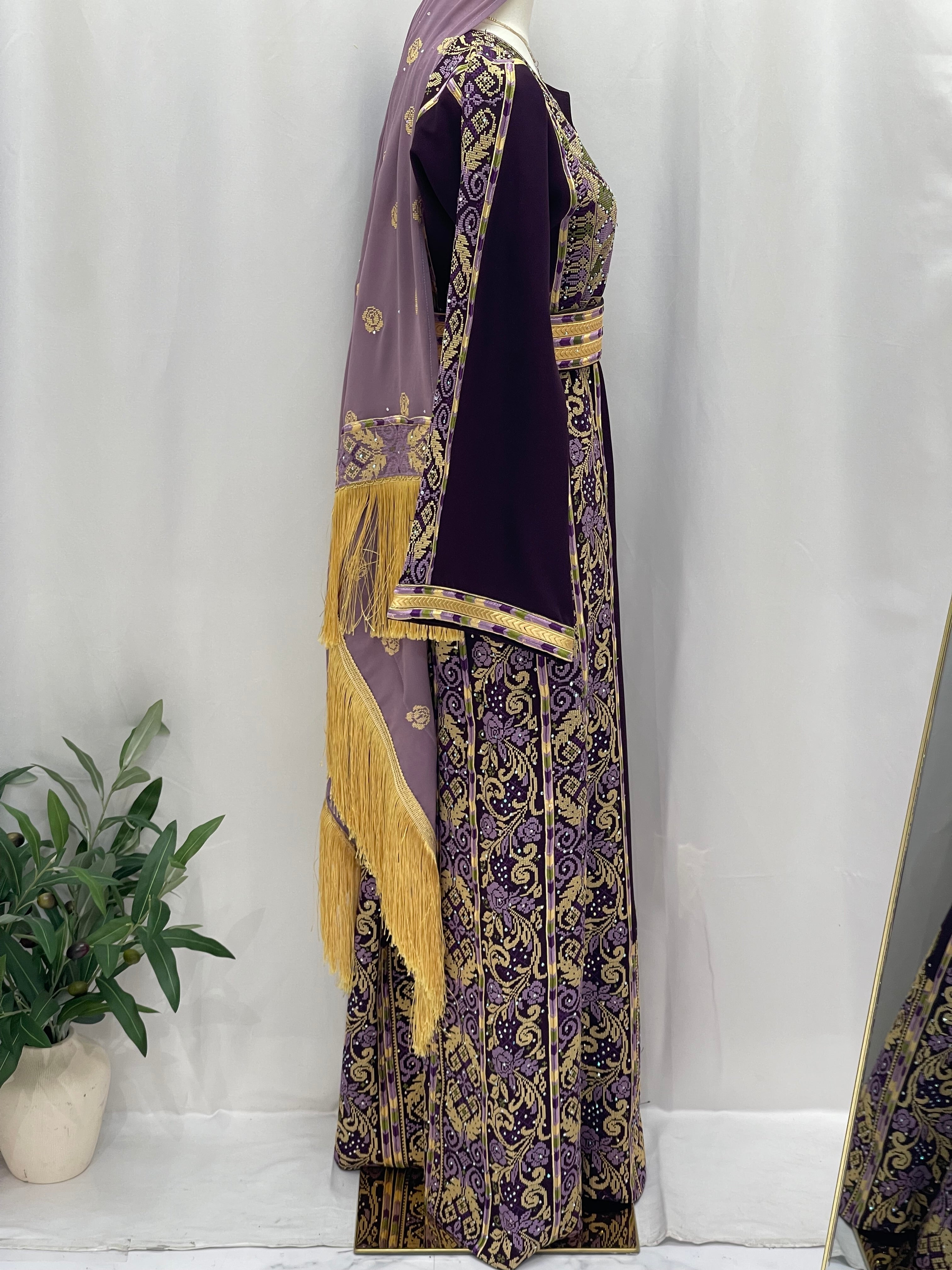 Arjwan Embroidered Thoub in purple with intricate gold patterns and decorative fringe detailing