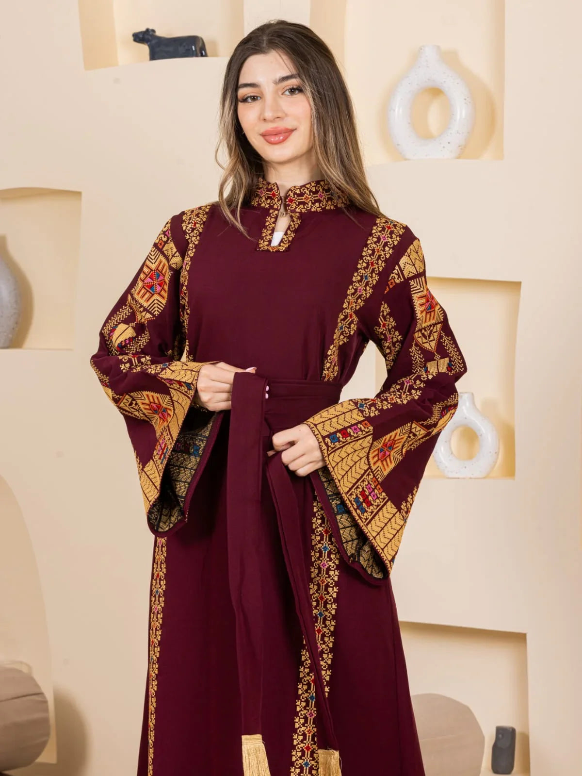 Asala Embroidered Thoub maroon Palestinian Elegance long sleeve embroidered thoub with wide bell sleeves and waist sash