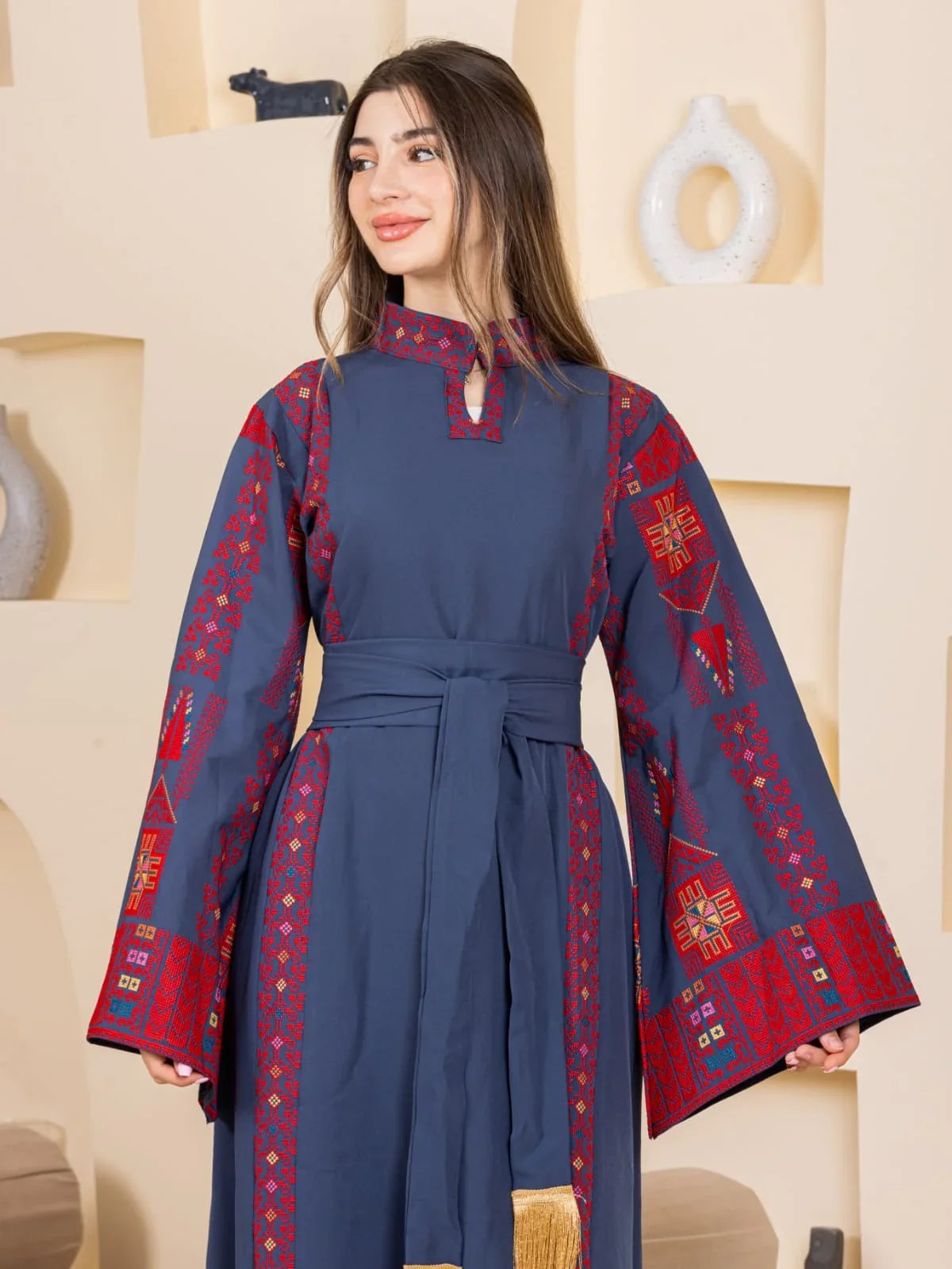 Asala Embroidered Thoub navy Palestinian Elegance long embroidered thobe with red geometric sleeve patterns and waist sash