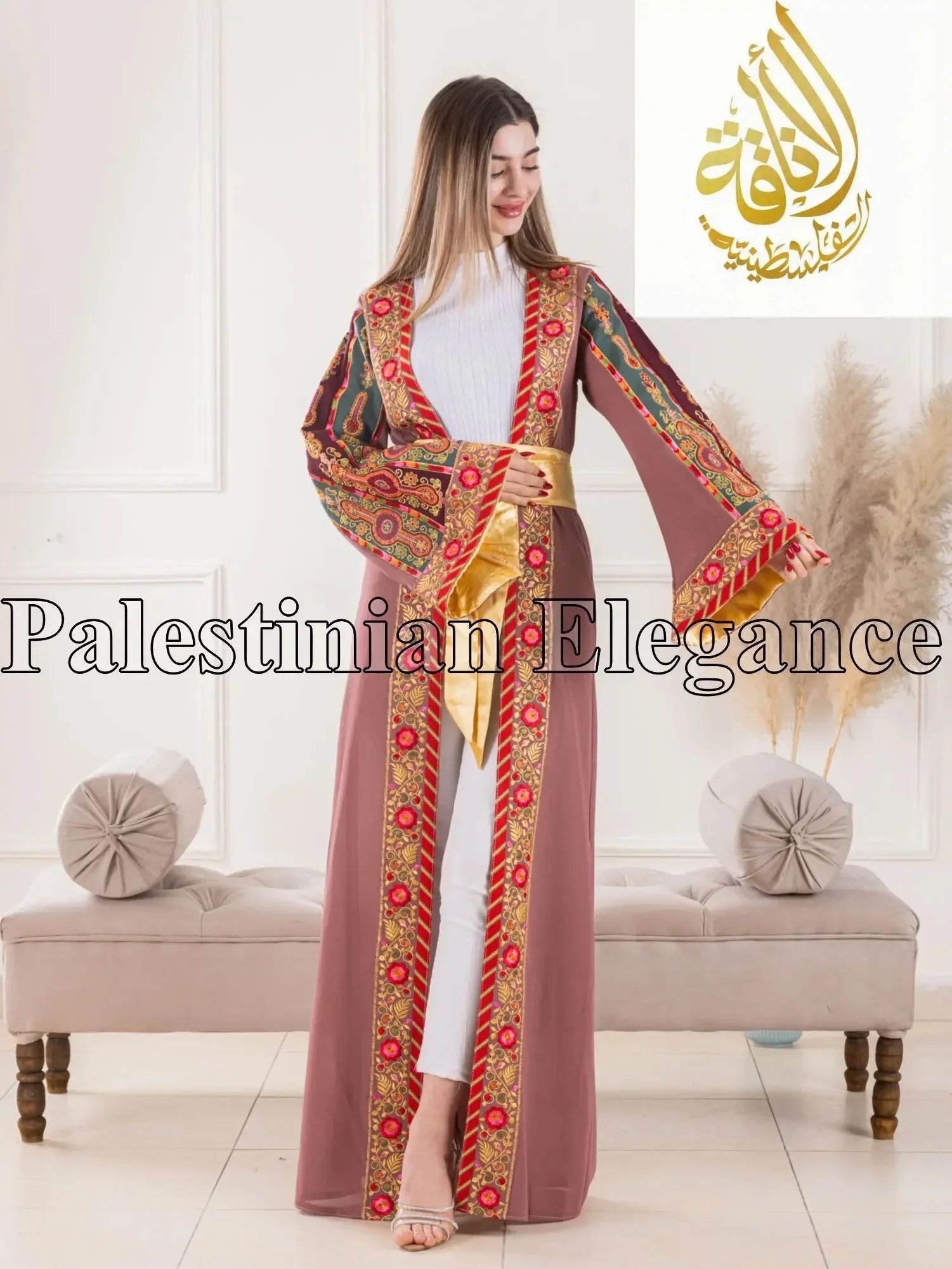 Aseel Malaka embroidered Cardigan by Palestinian Elegance worn by woman with colorful traditional embroidery and gold sash