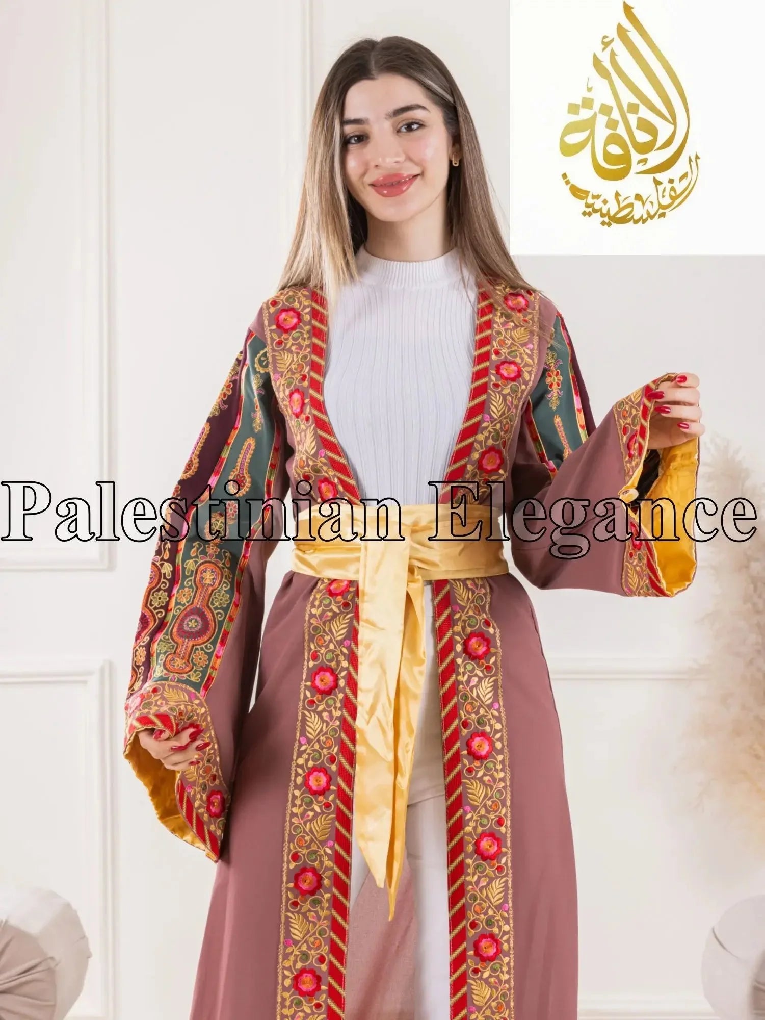 Palestinian Elegance Aseel Malaka embroidered Cardigan with intricate red and gold patterns and a yellow sash belt