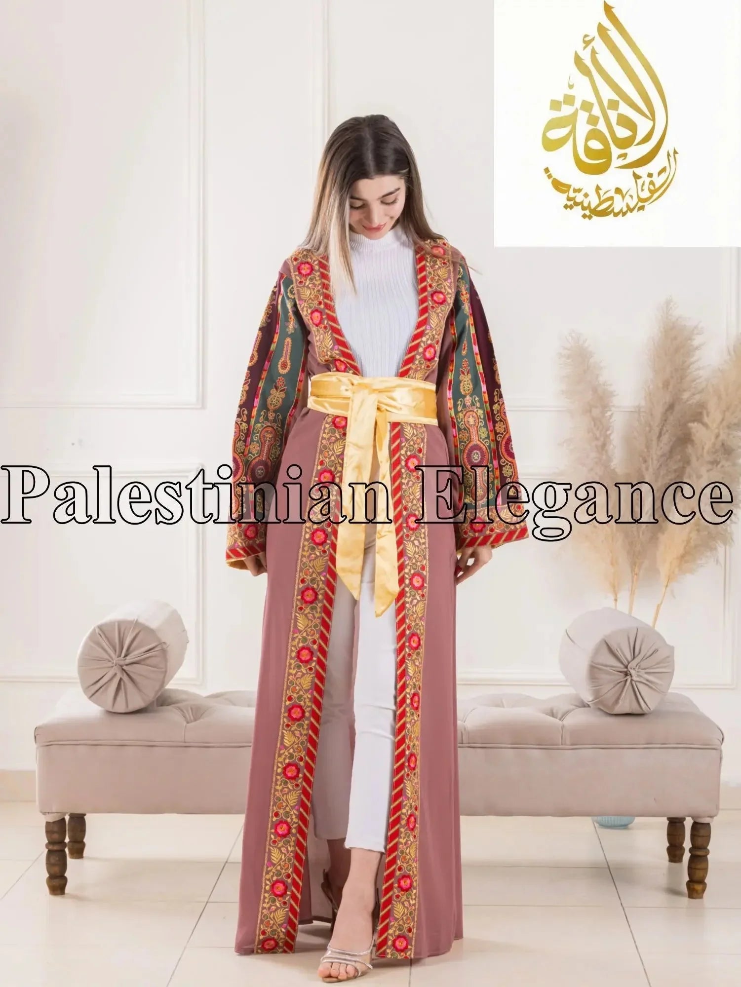 Aseel Malaka embroidered Cardigan by Palestinian Elegance worn by model with intricate floral patterns and yellow sash belt