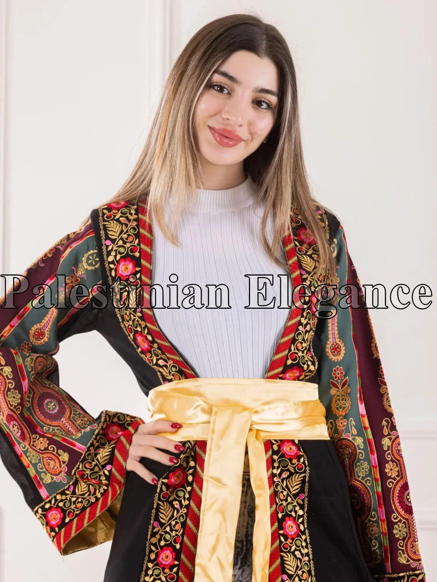 Aseel Malaka embroidered Cardigan by Palestinian Elegance with intricate floral and geometric designs and a golden sash
