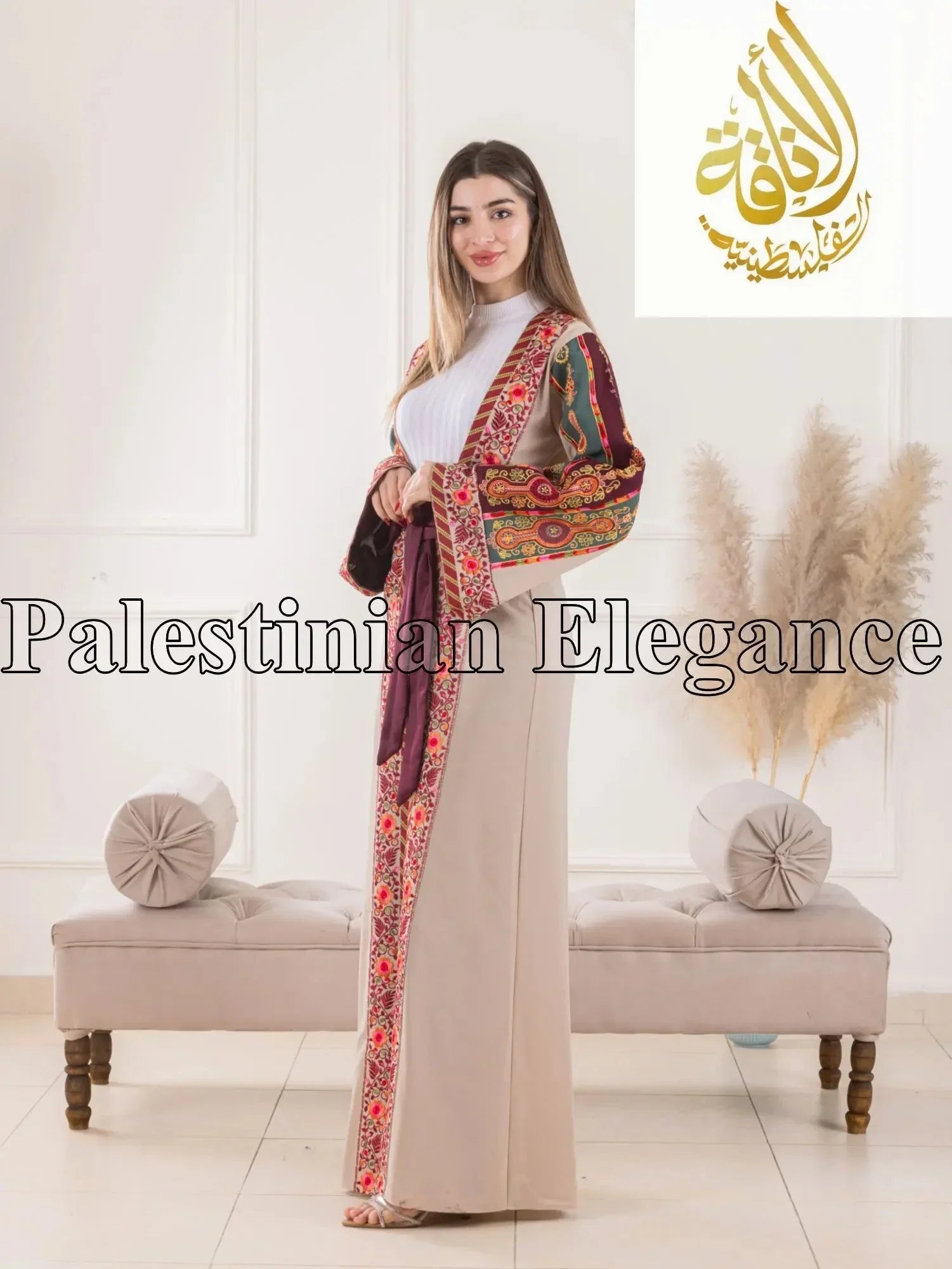 Woman wearing Aseel Malaka embroidered Cardigan by Palestinian Elegance with colorful traditional patterns
