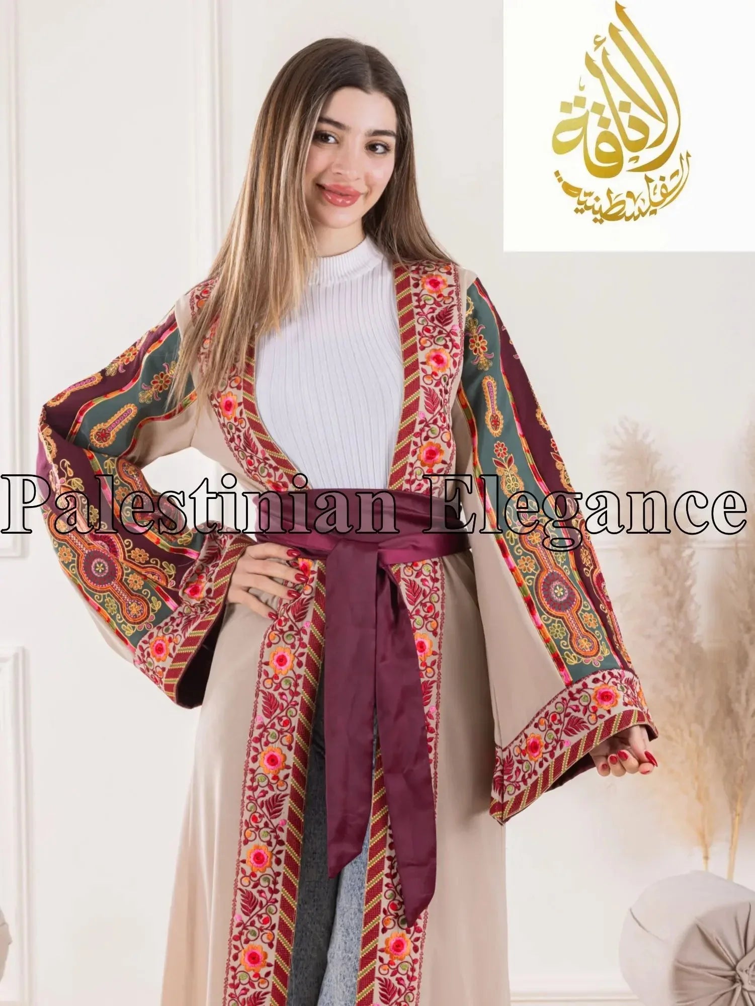 Aseel Malaka embroidered Cardigan from Palestinian Elegance worn by woman with floral and geometric patterns