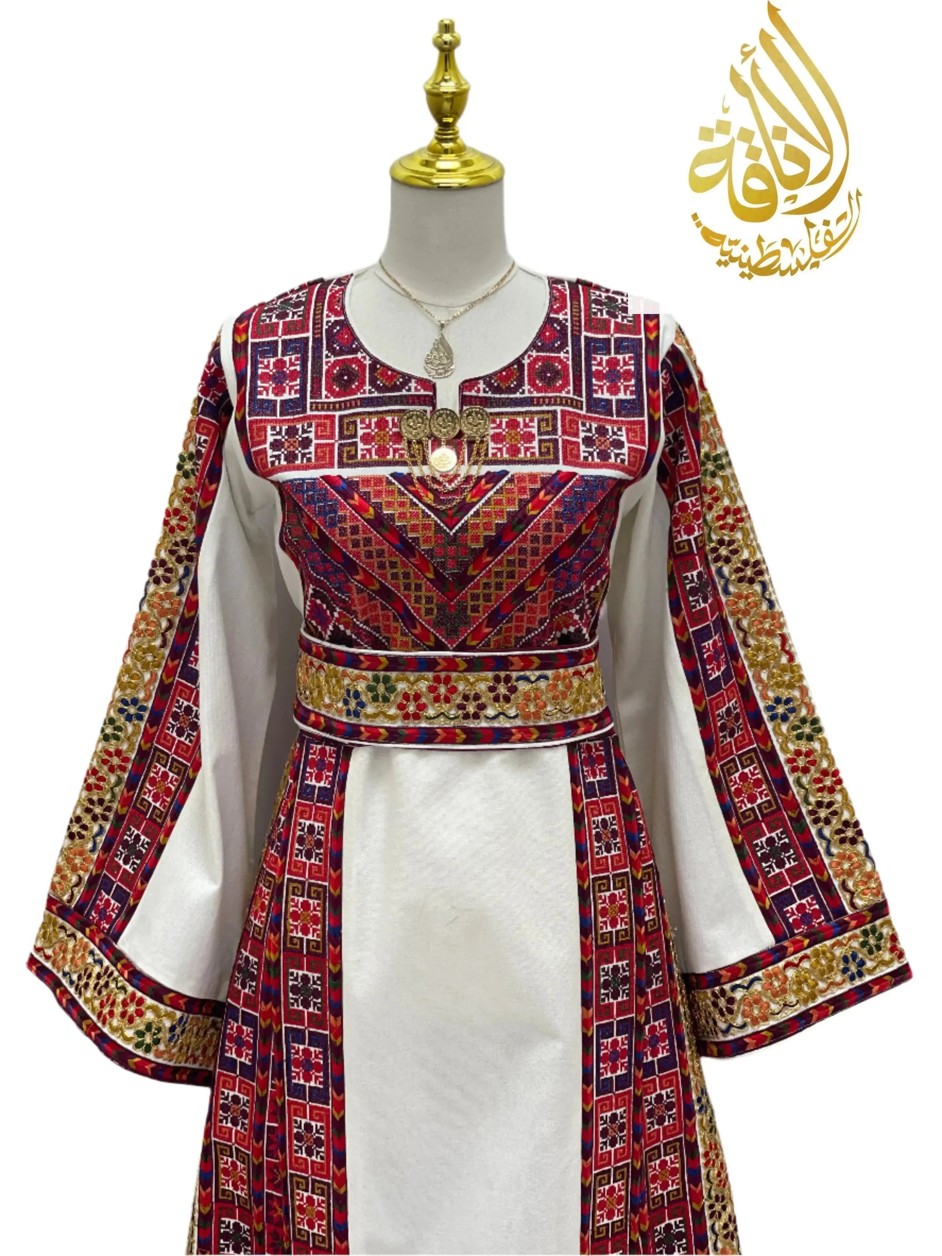 Azhar Atameen Embroidered Thoub by Palestinian Elegance with intricate red and gold traditional embroidery on white fabric