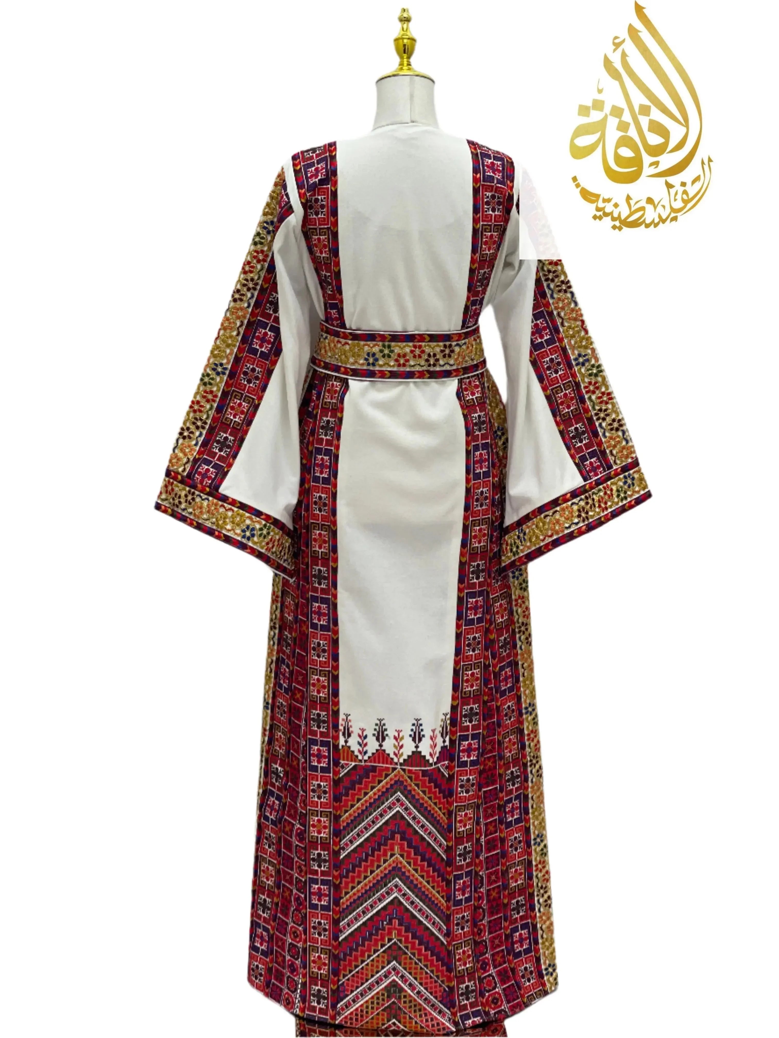 Azhar Atameen Embroidered Thoub by Palestinian Elegance featuring intricate red and gold traditional embroidery on white fabric