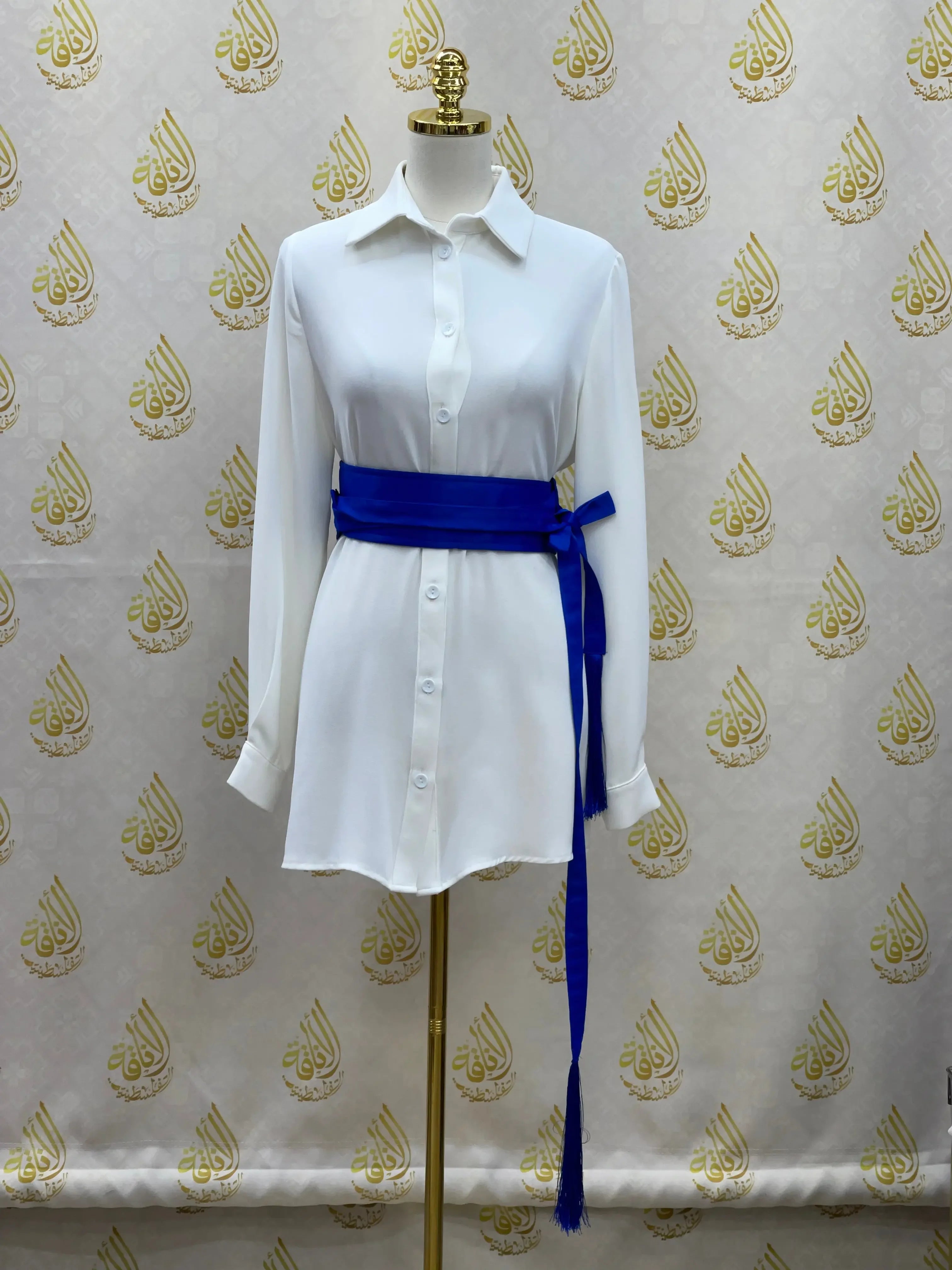 Luxury satin belt for dresses in royal blue by Palestinian Elegance styled on white button-up dress