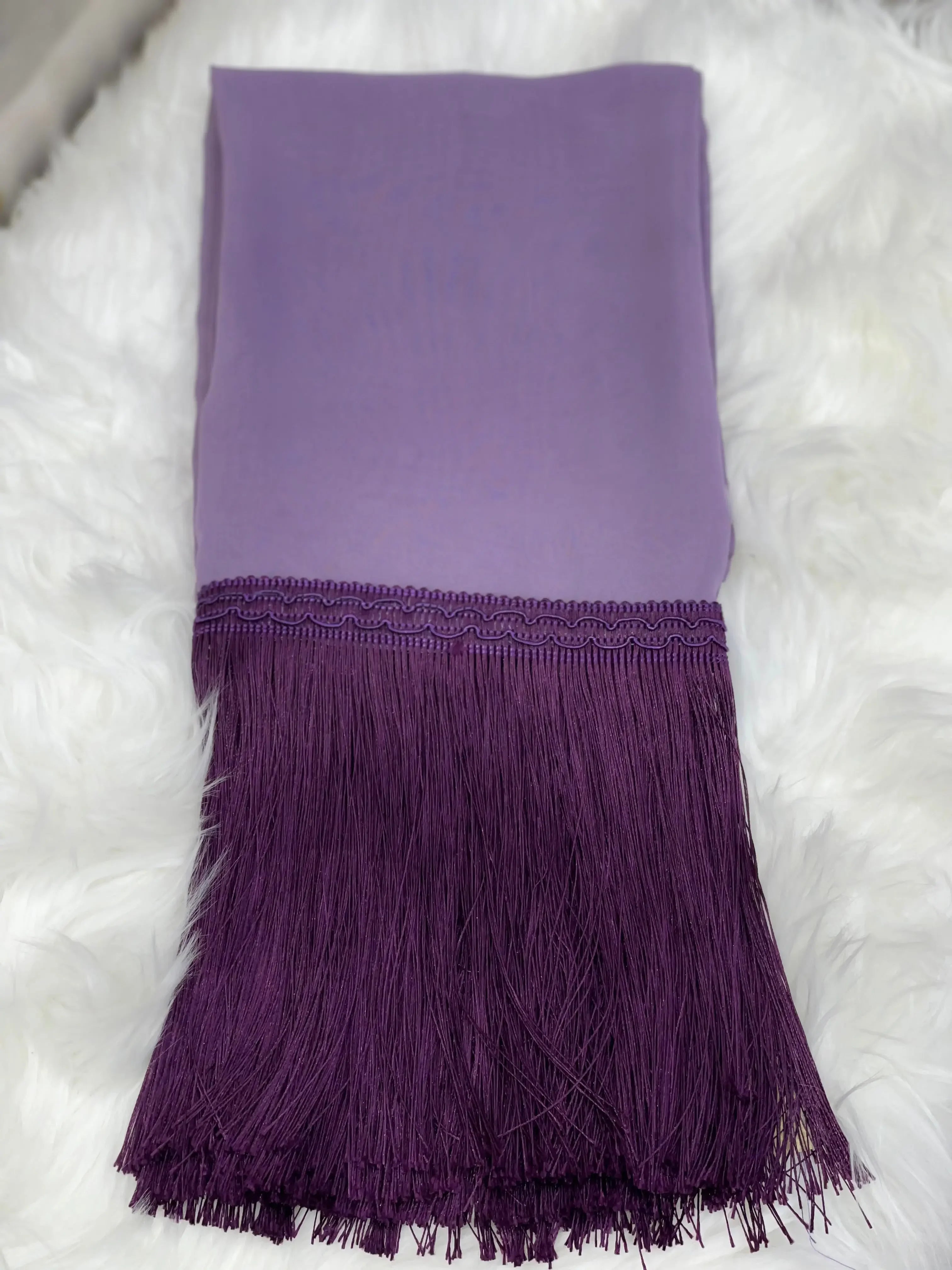 Purple shawl with long fringes by Palestinian Elegance traditional Palestinian khirka on white fabric background