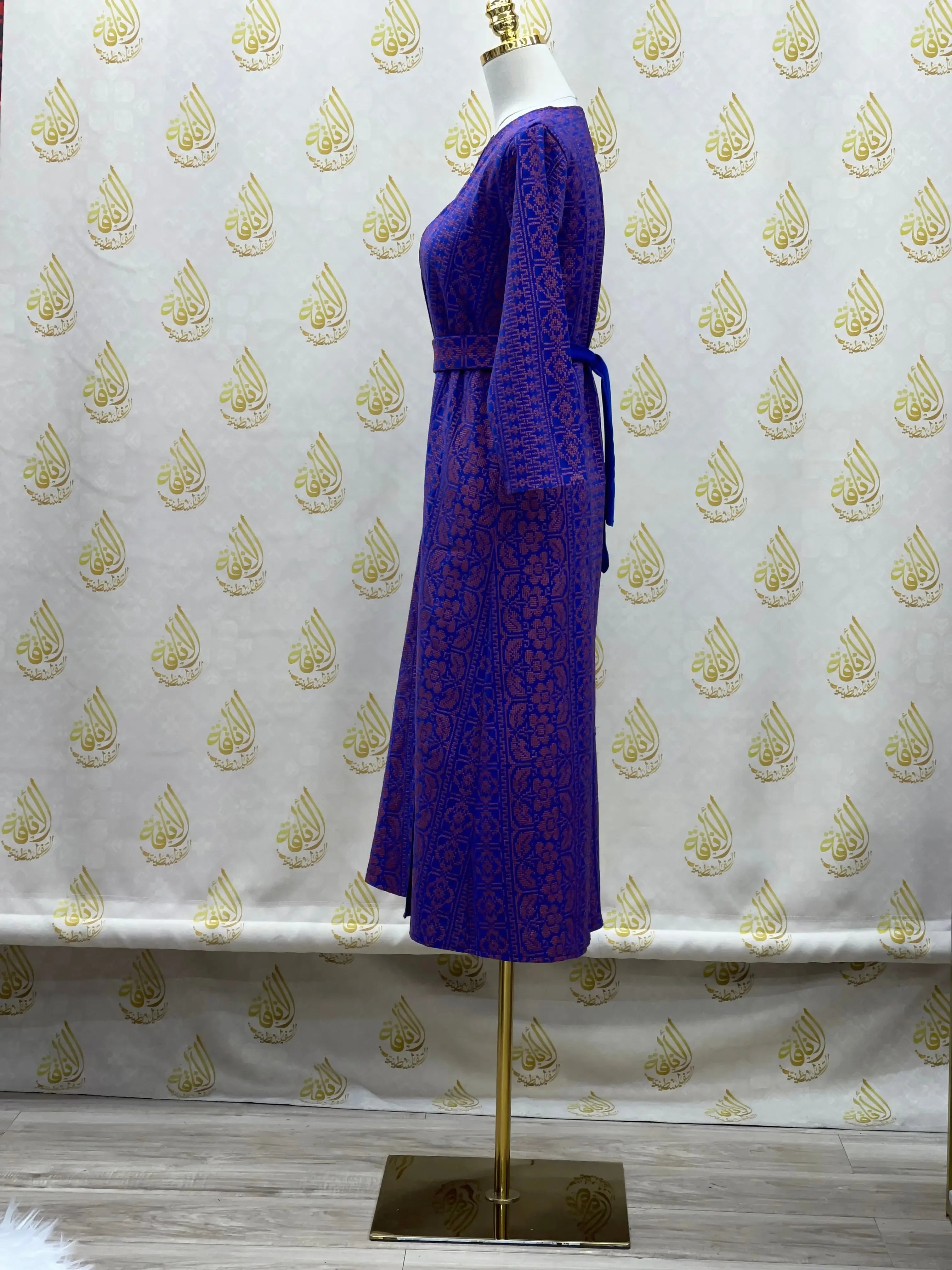 Purple embroidered cardigan for kids with long sleeves and detailed floral patterns by Palestinian Elegance