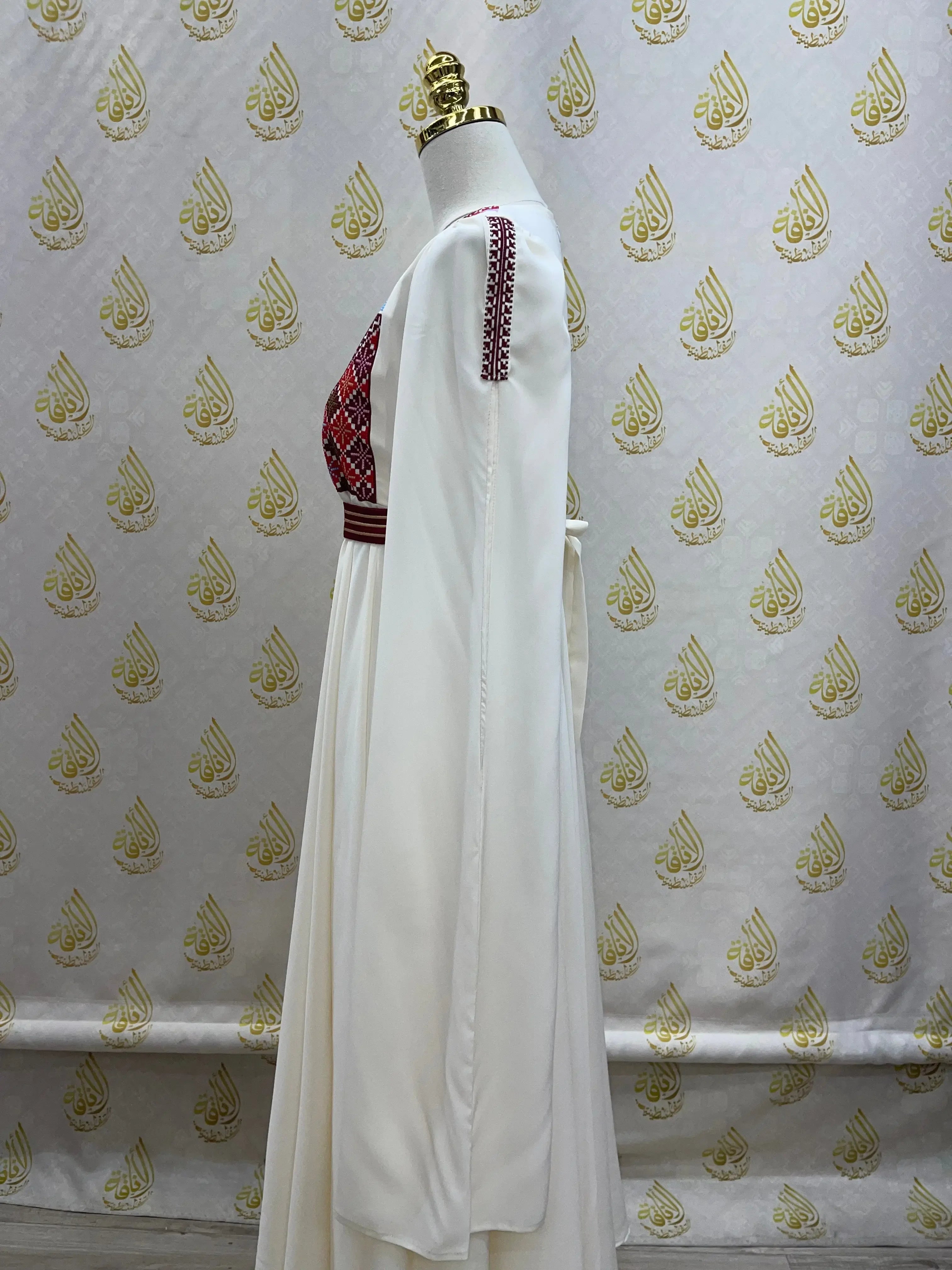 Palestinian girls embroidered dress in white with red detailed embroidery on the chest and shoulders
