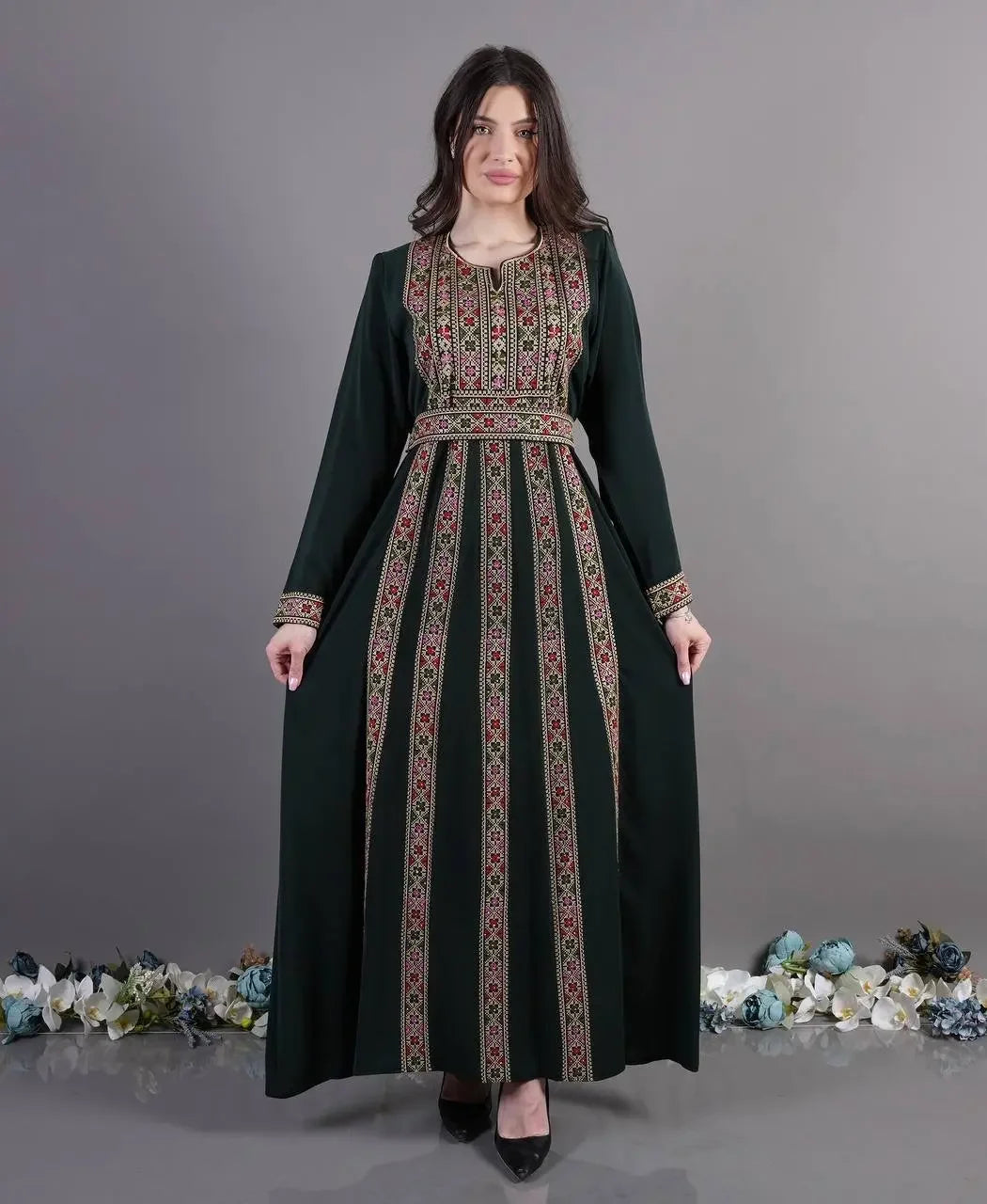 Palestinian Elegance embroidered abaya dress with intricate floral patterns on dark fabric