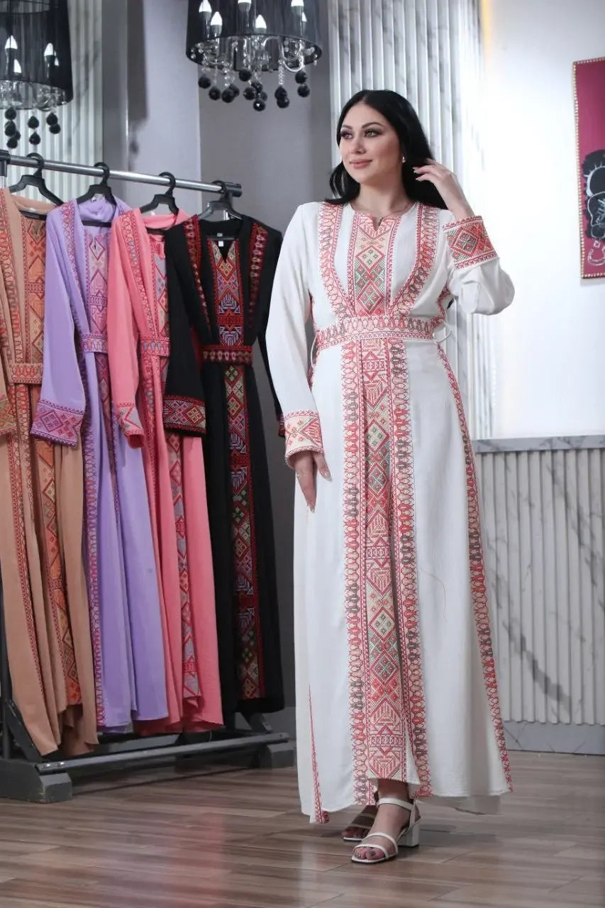 Palestinian Elegance embroidered abaya for women in white with traditional red patterns and long sleeves