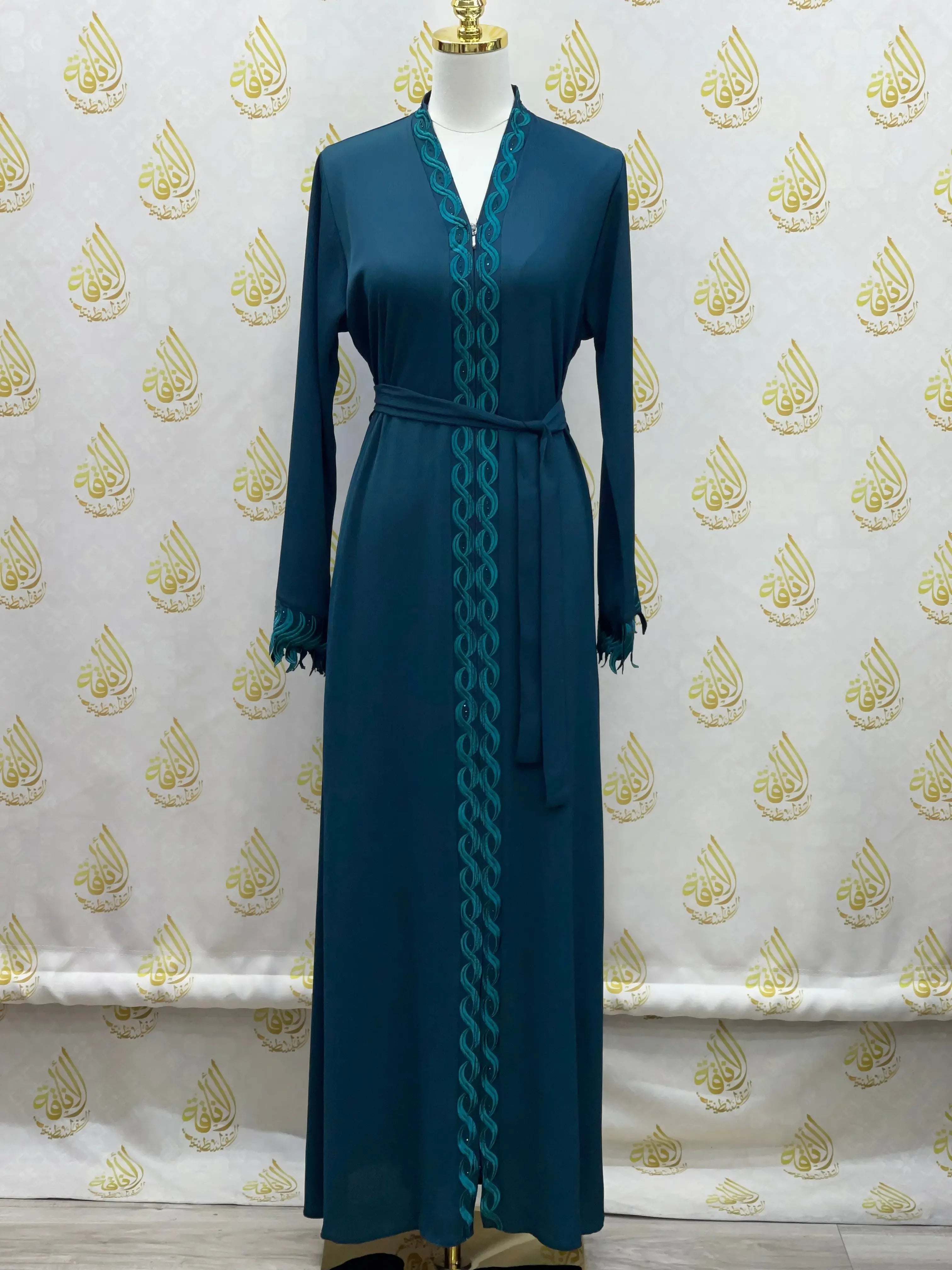 Elegant embroidered abaya in dark teal with intricate front embroidery and matching belt by Palestinian Elegance