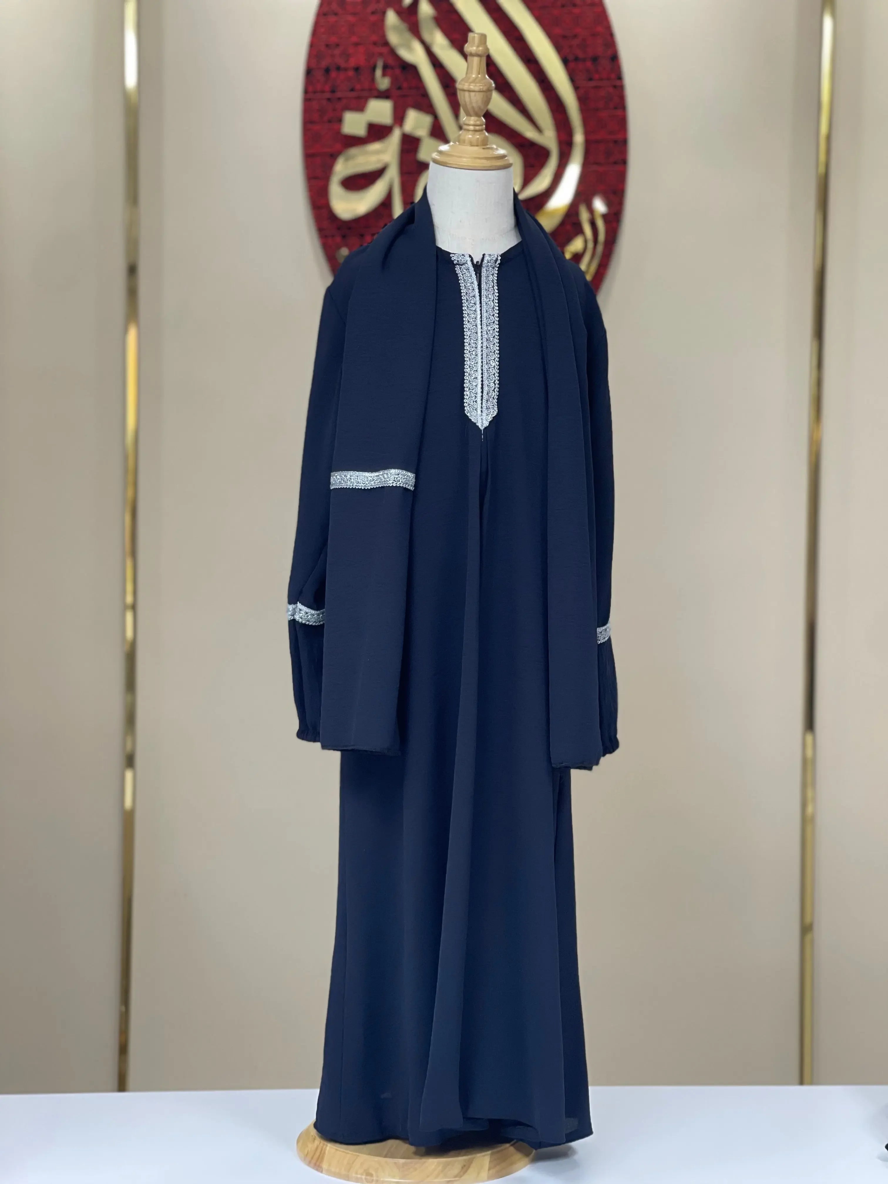 Navy blue girls embroidered abaya with silver embroidery on neckline and sleeves by Palestinian Elegance